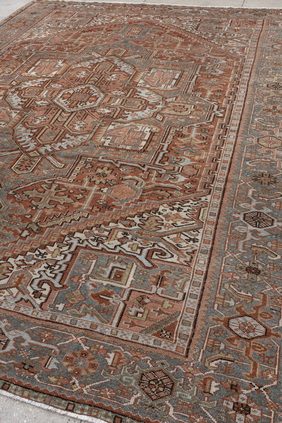 9' x 11' one-of-a-kind handmade vintage Heriz large size rug. Color palette: rust, blue-gray, ivory, coral, taupe, charcoal