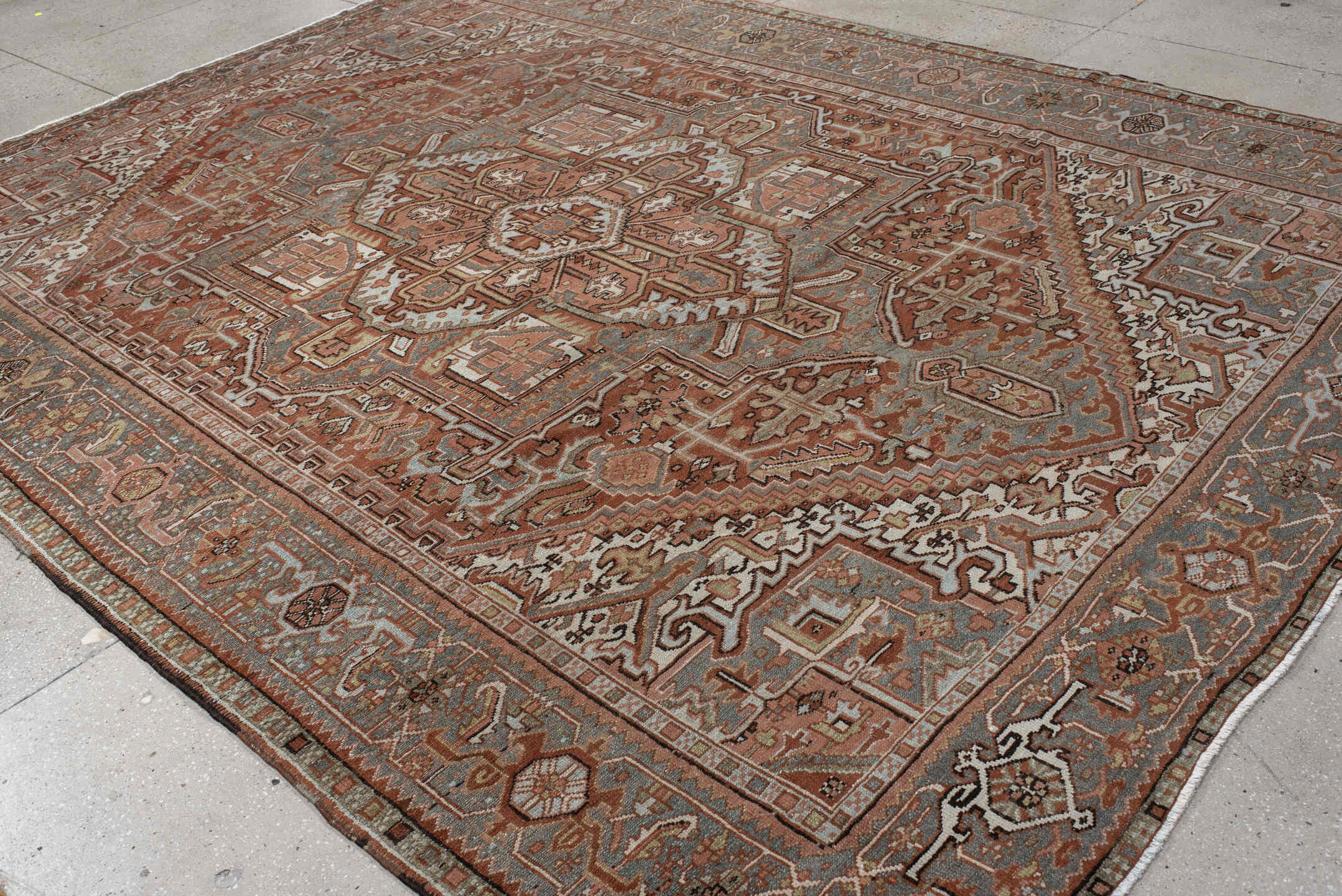 9' x 11' one-of-a-kind handmade vintage Heriz large size rug. Color palette: rust, blue-gray, ivory, coral, taupe, charcoal
