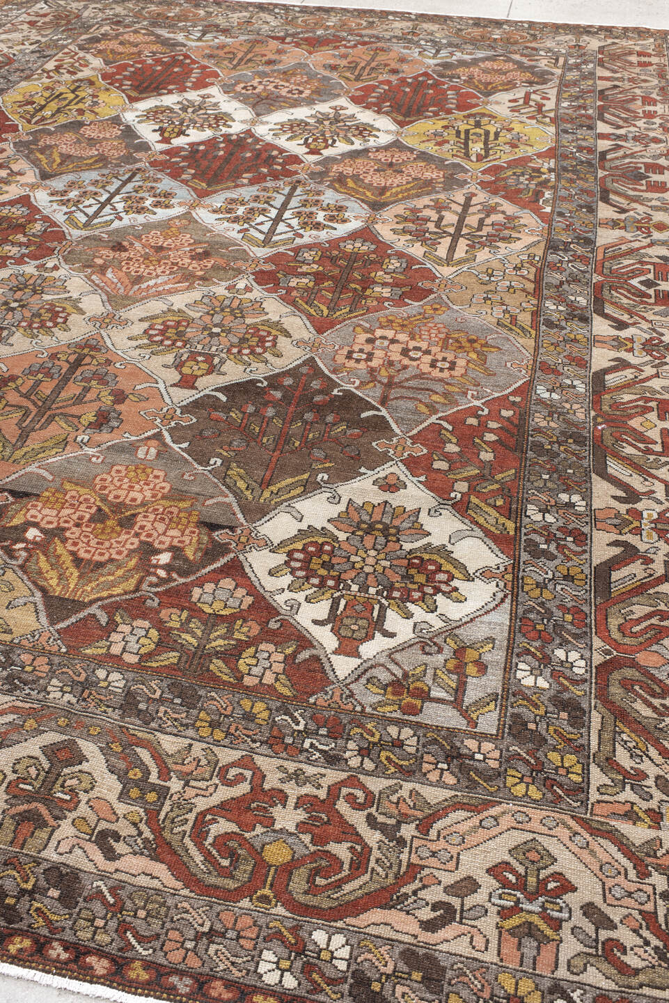 10' x 13' one-of-a-kind handmade vintage Baktiary large size rug. Color palette: taupe, rust, ivory, brown, slate, rose