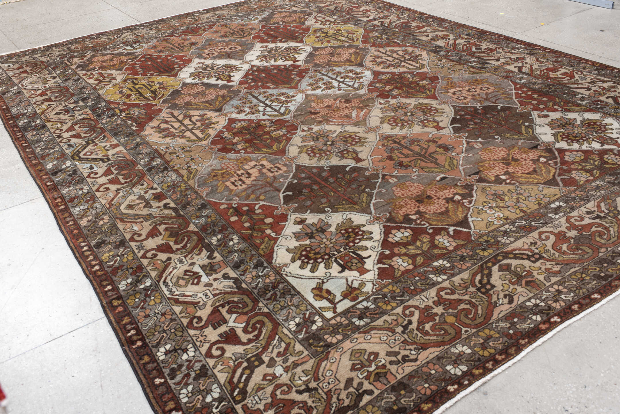 10' x 13' one-of-a-kind handmade vintage Baktiary large size rug. Color palette: taupe, rust, ivory, brown, slate, rose