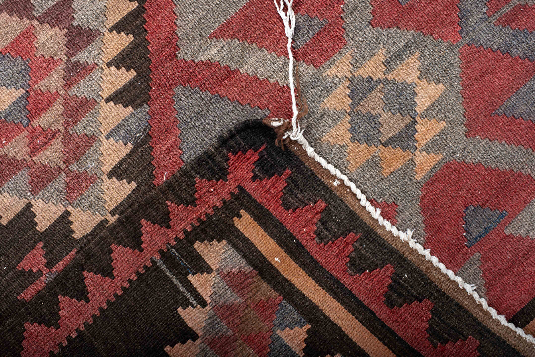 4' x 7' one-of-a-kind handmade antique Kilim rug. Color palette: brown, rust, ivory, slate, rose, charcoal, terracotta, gray