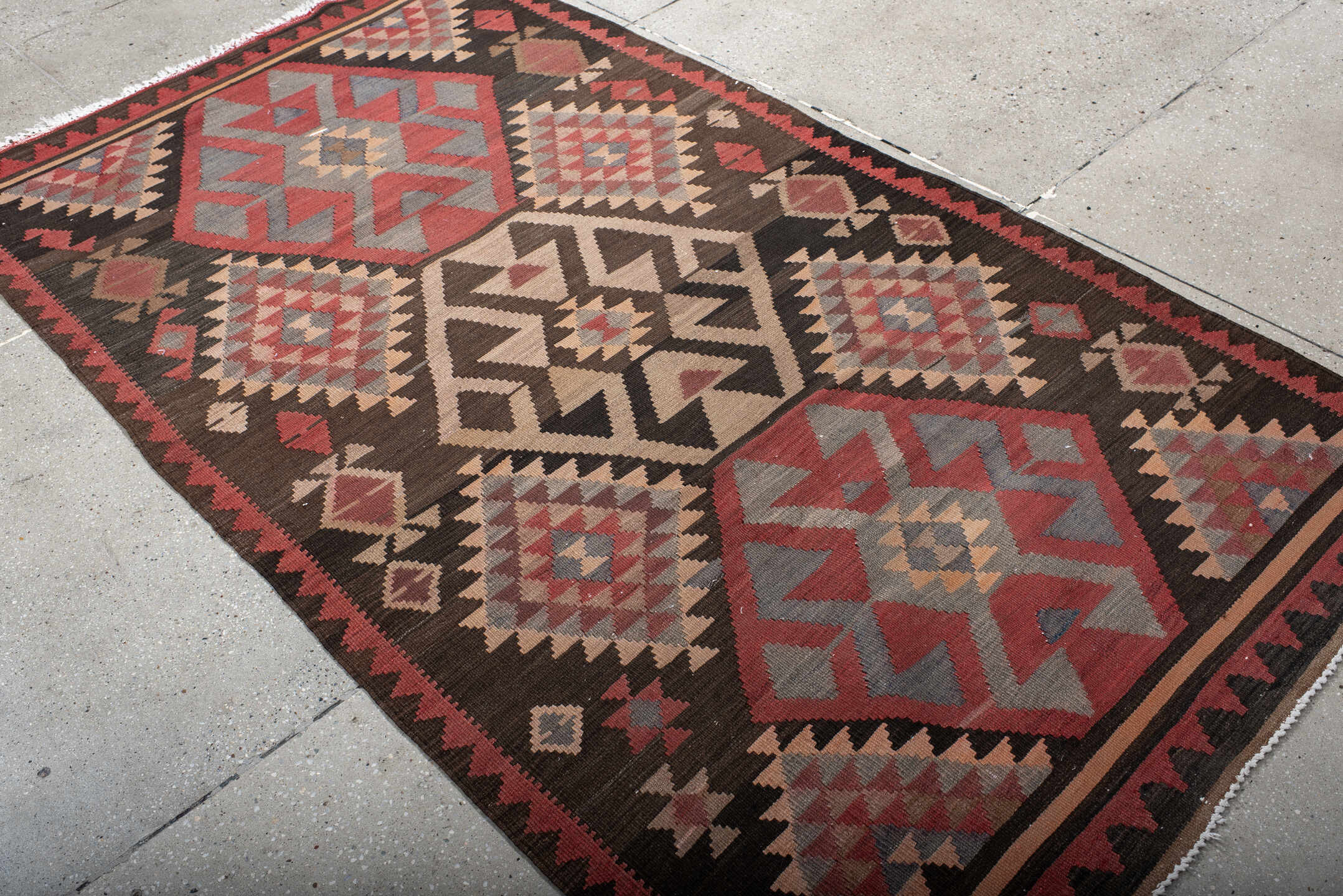 4' x 7' one-of-a-kind handmade antique Kilim rug. Color palette: brown, rust, ivory, slate, rose, charcoal, terracotta, gray