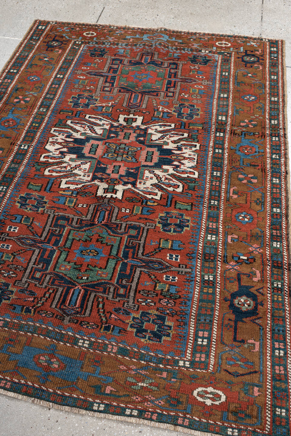 4' x 6' one-of-a-kind handmade vintage  rug. Color palette: rust, teal, camel, navy, ivory, rose, brown, terracotta, beige