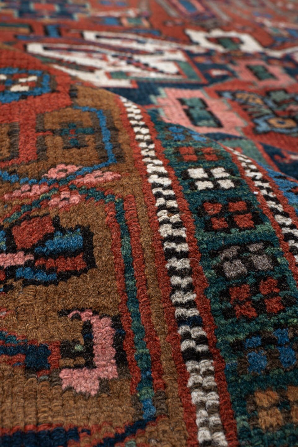 4' x 6' one-of-a-kind handmade vintage  rug. Color palette: rust, teal, camel, navy, ivory, rose, brown, terracotta, beige