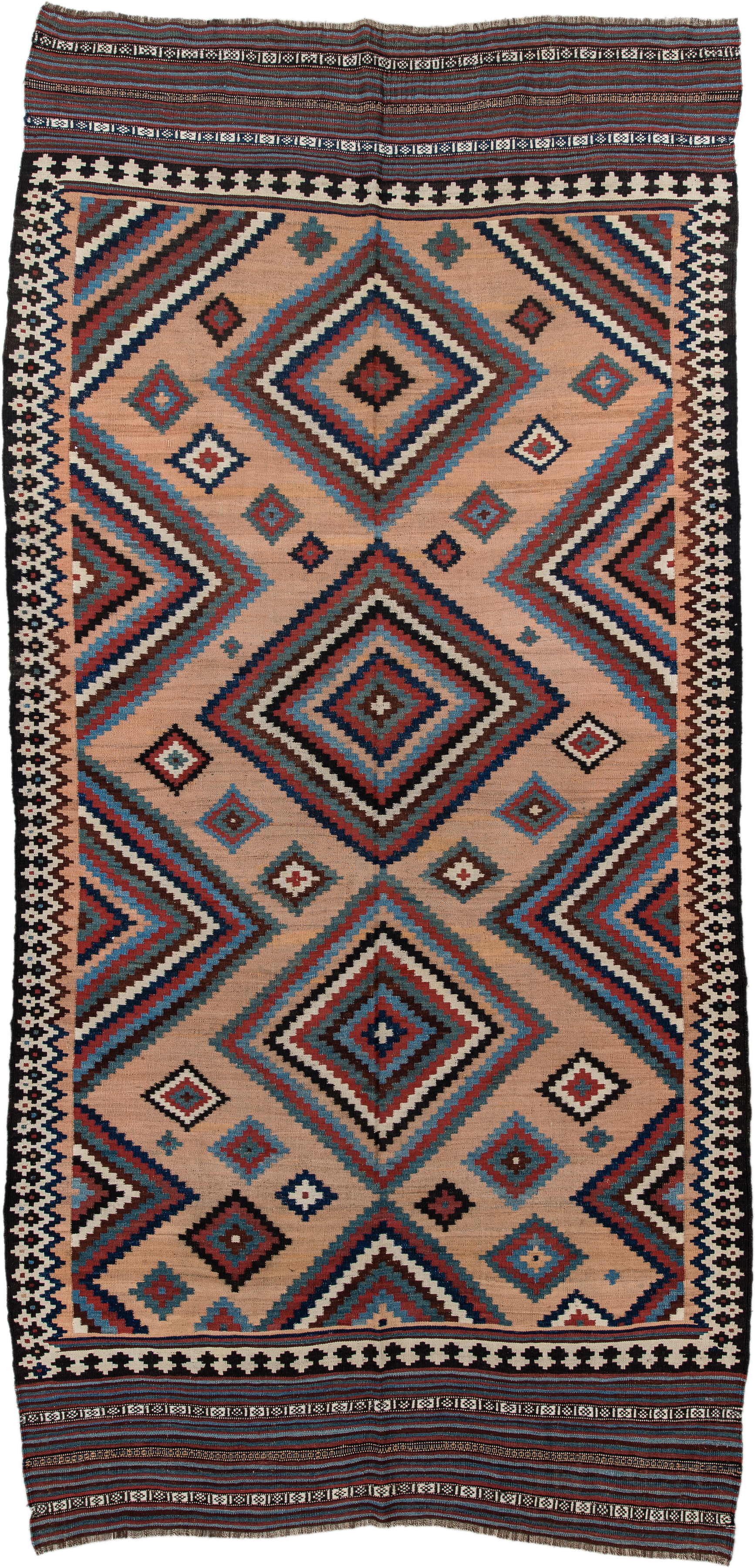 5' x 10' one-of-a-kind handmade antique Kilim runner rug. Color palette: camel, indigo, ivory, rust, turquoise, charcoal