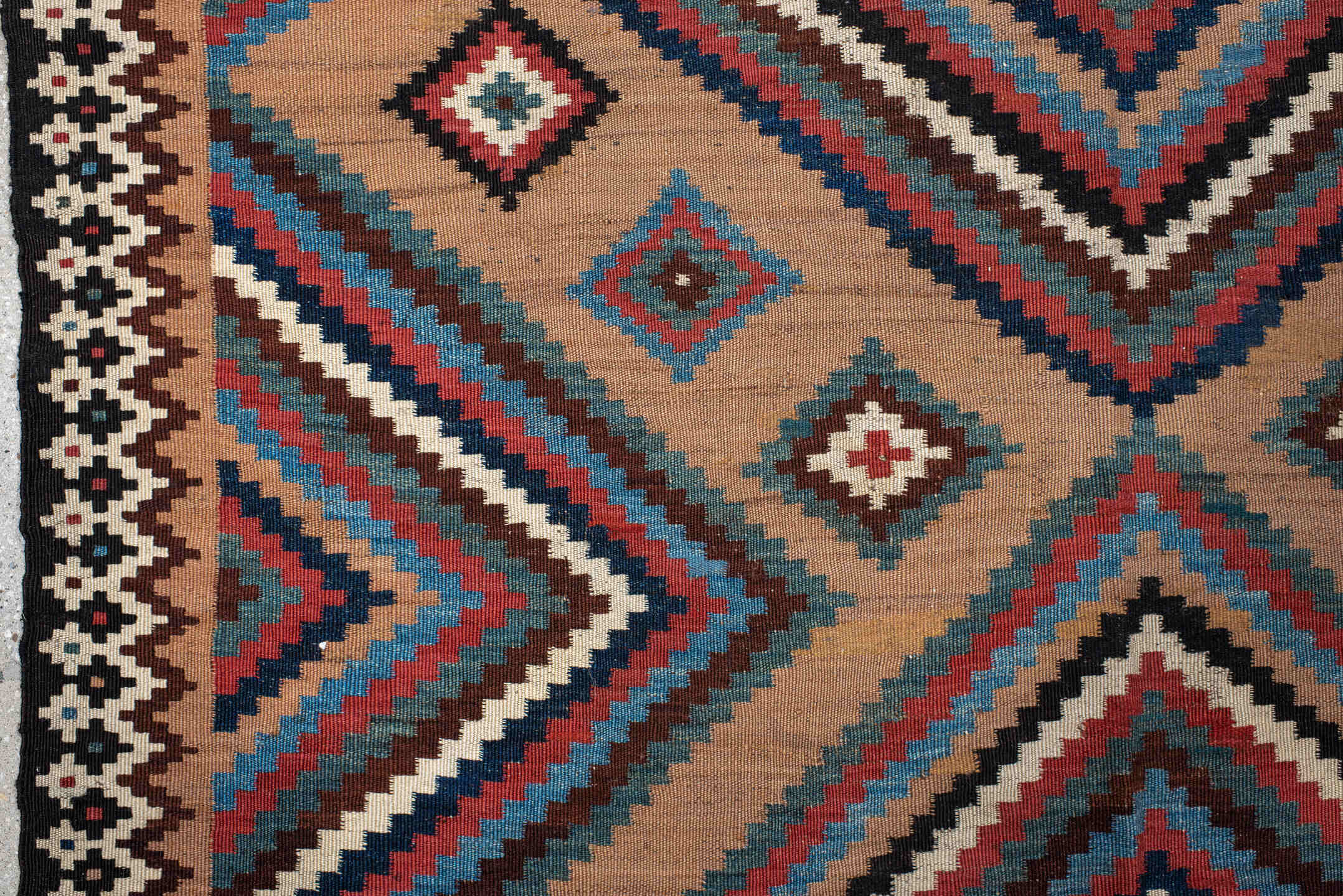 5' x 10' one-of-a-kind handmade antique Kilim runner rug. Color palette: camel, indigo, ivory, rust, turquoise, charcoal