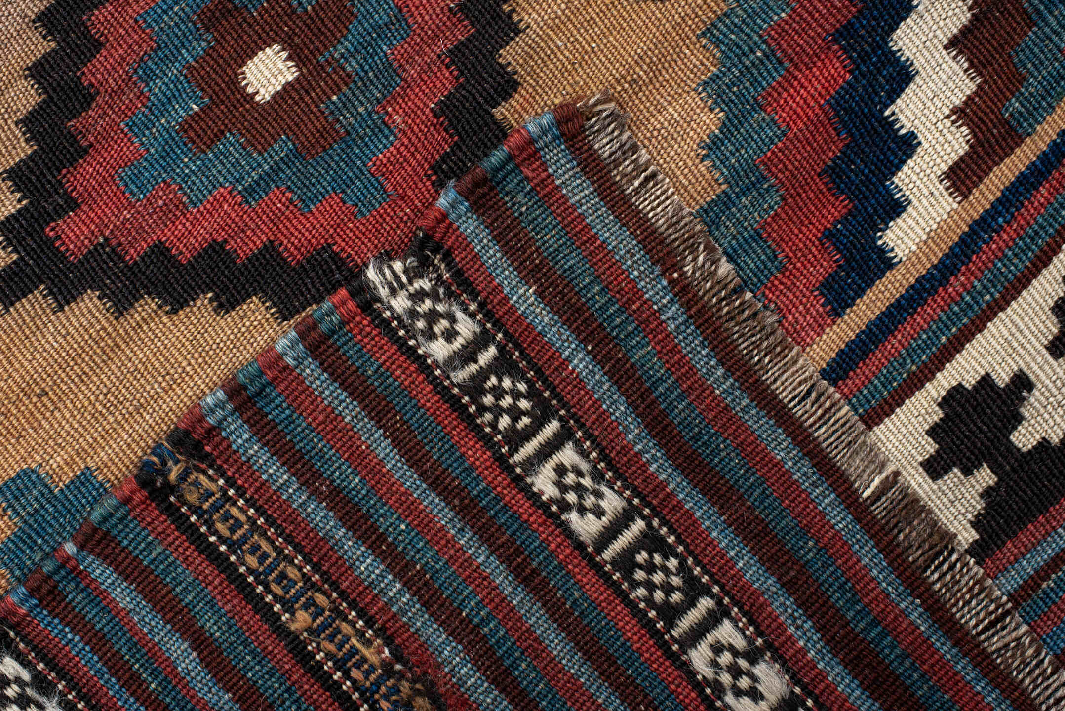 5' x 10' one-of-a-kind handmade antique Kilim runner rug. Color palette: camel, indigo, ivory, rust, turquoise, charcoal