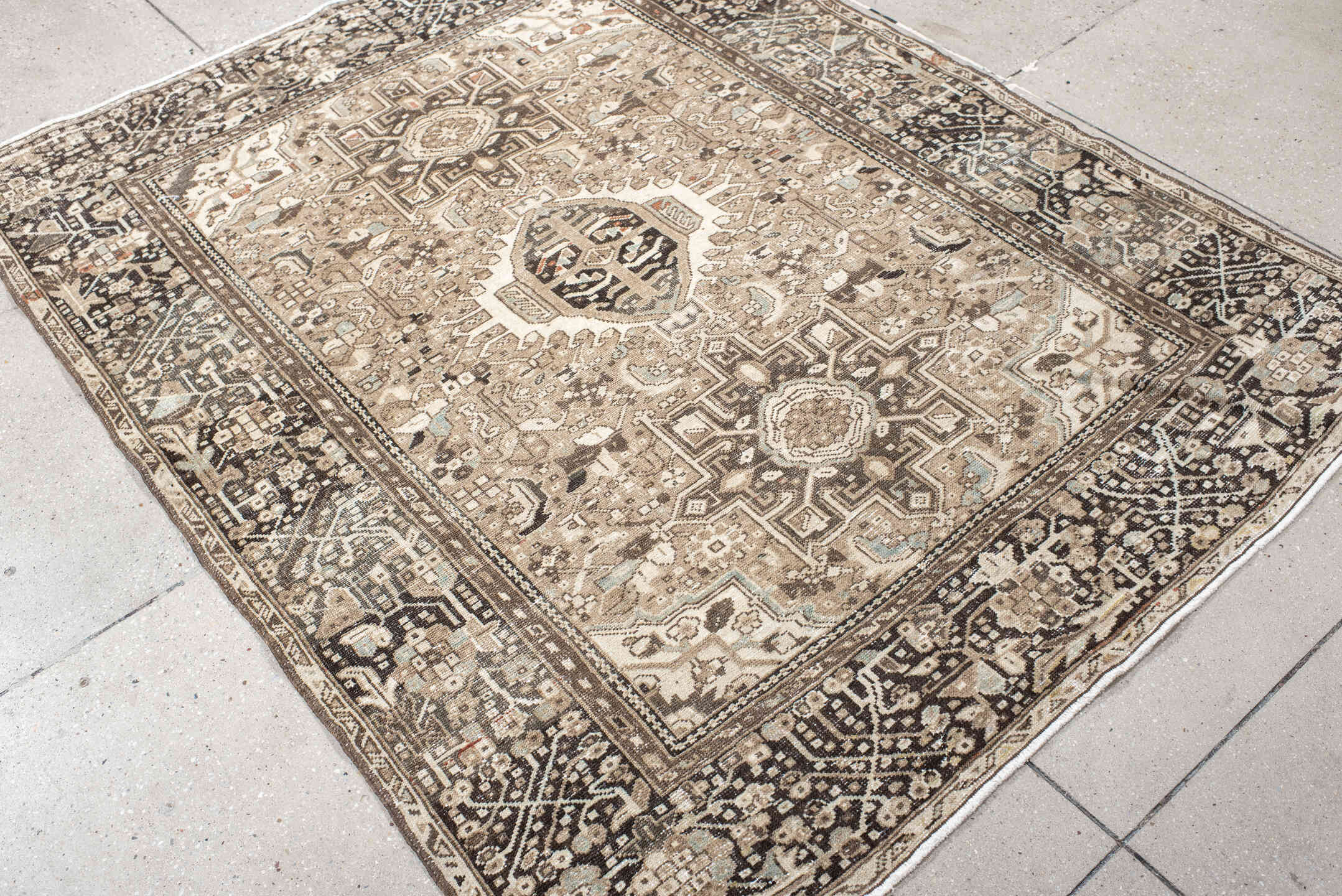 4' x 6' one-of-a-kind handmade antique Karaje small size rug. Color palette: taupe, ivory, brown, charcoal, camel, pale_blue