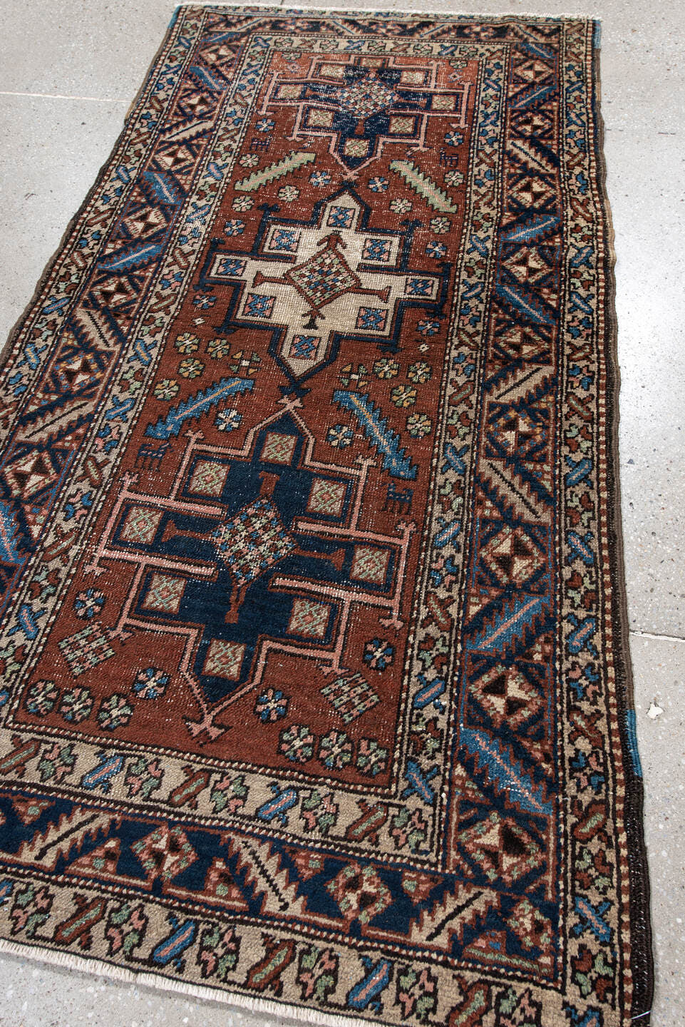 3' x 5' one-of-a-kind handmade antique Heriz small size rug. Color palette: rust, navy, ivory, sky_blue, brown, sage, camel