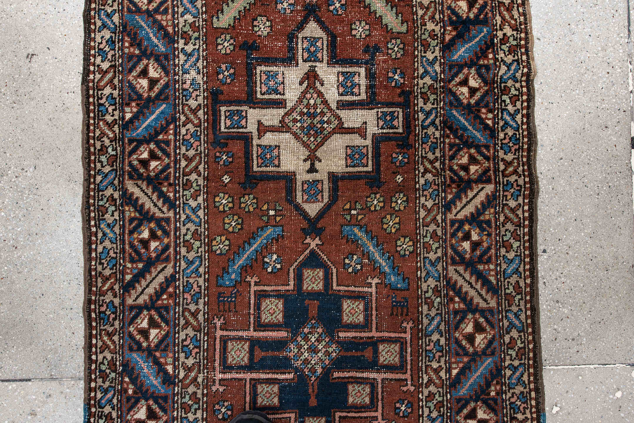 3' x 5' one-of-a-kind handmade antique Heriz small size rug. Color palette: rust, navy, ivory, sky_blue, brown, sage, camel