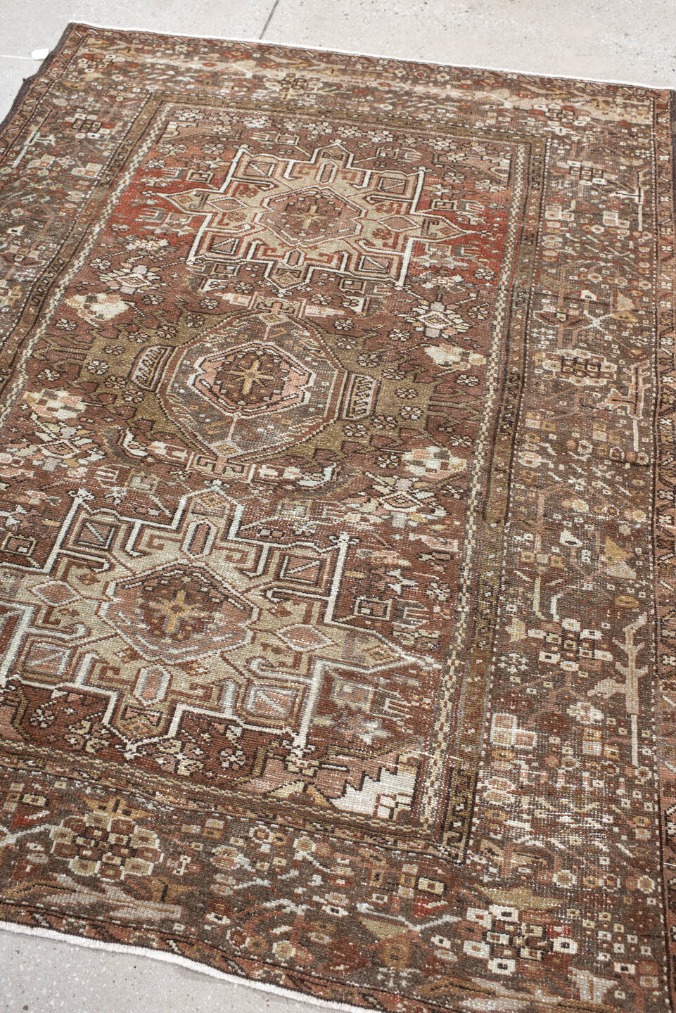 4' x 5' one-of-a-kind handmade antique Karaje small size rug. Color palette: brown, terra cotta, ivory, taupe, camel, rust