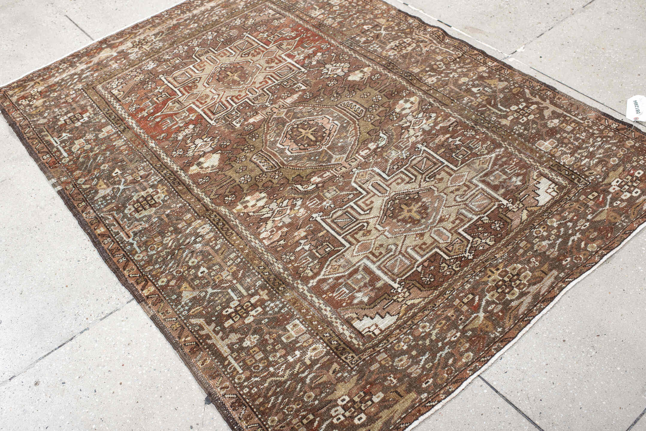 4' x 5' one-of-a-kind handmade antique Karaje small size rug. Color palette: brown, terra cotta, ivory, taupe, camel, rust
