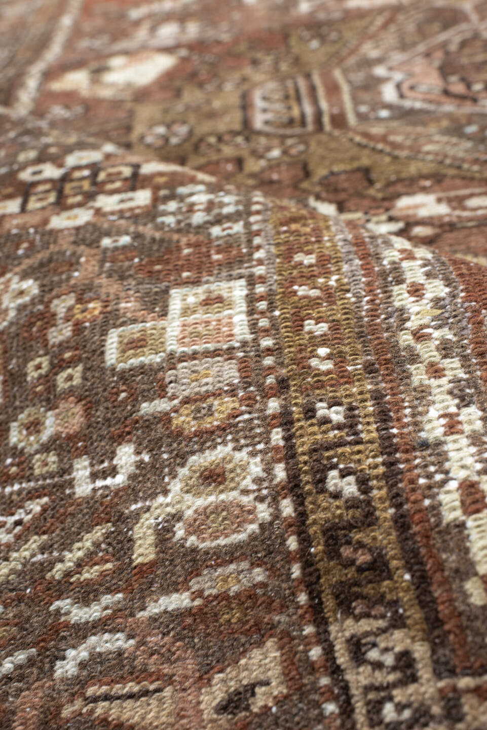 4' x 5' one-of-a-kind handmade antique Karaje small size rug. Color palette: brown, terra cotta, ivory, taupe, camel, rust