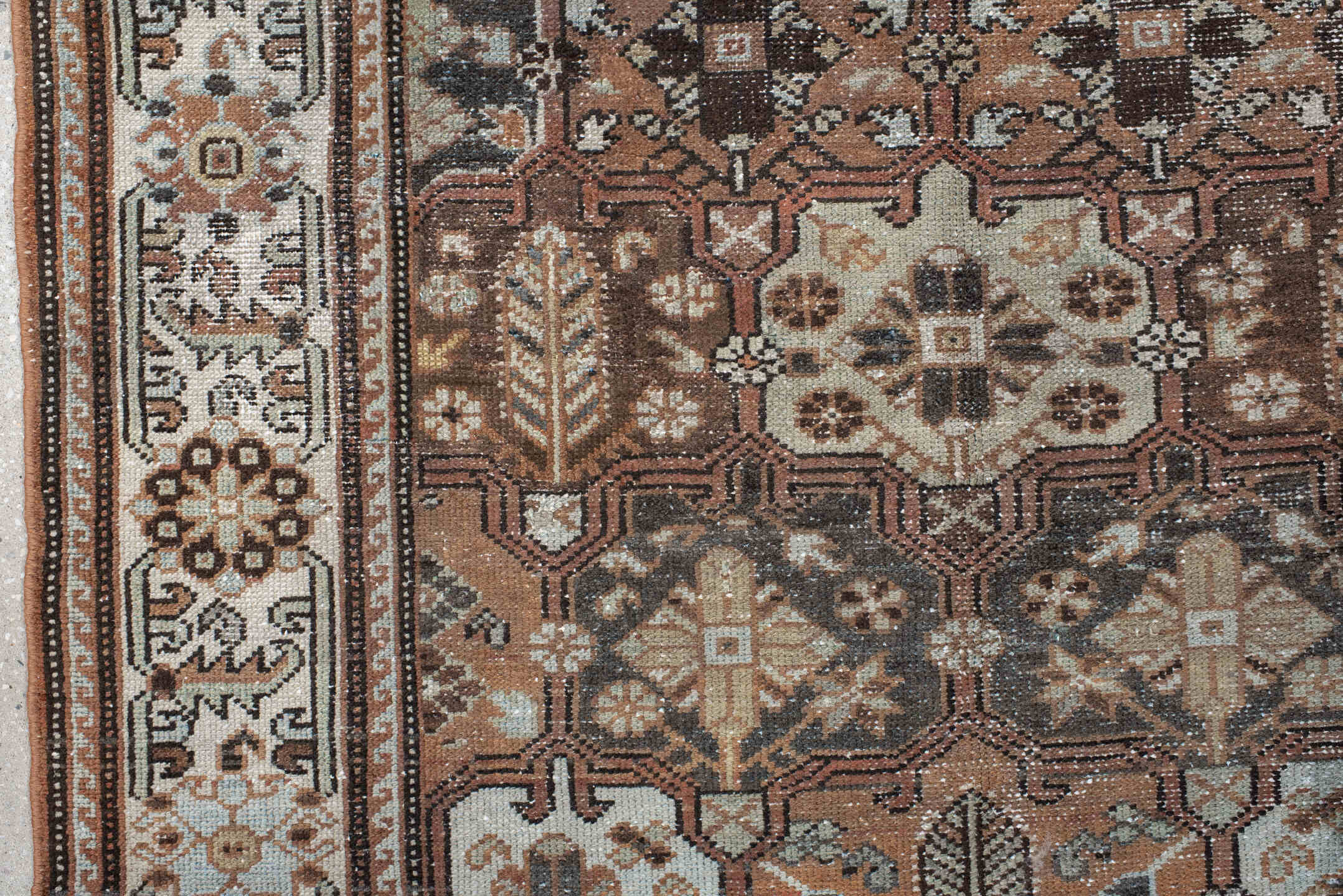 4' x 7' one-of-a-kind handmade vintage Baktiary rug. Color palette: black, brown, gray, light gray, off-white, pink, red