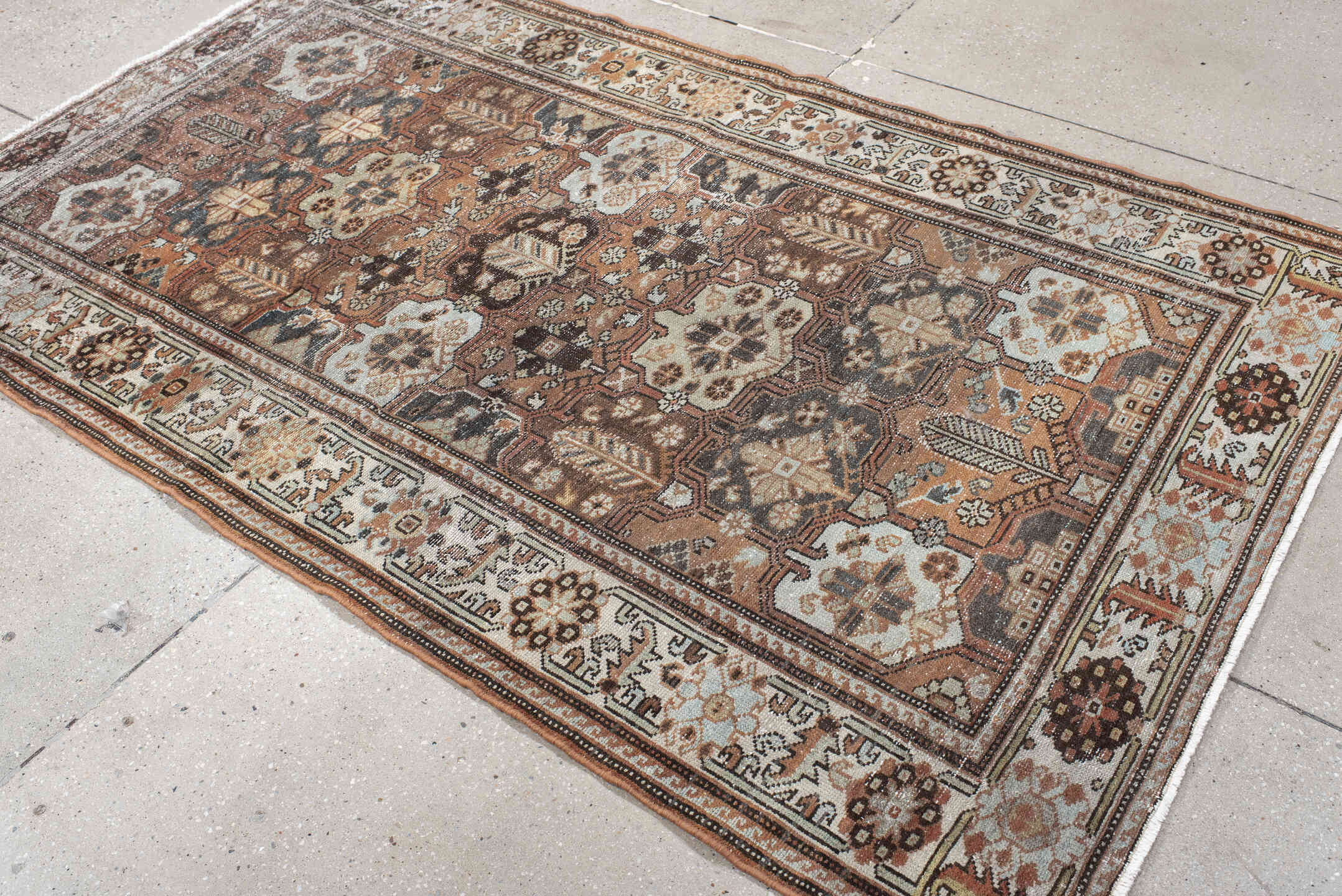 4' x 7' one-of-a-kind handmade vintage Baktiary rug. Color palette: rust, ivory, charcoal, soft blue, brown, camel, burgundy