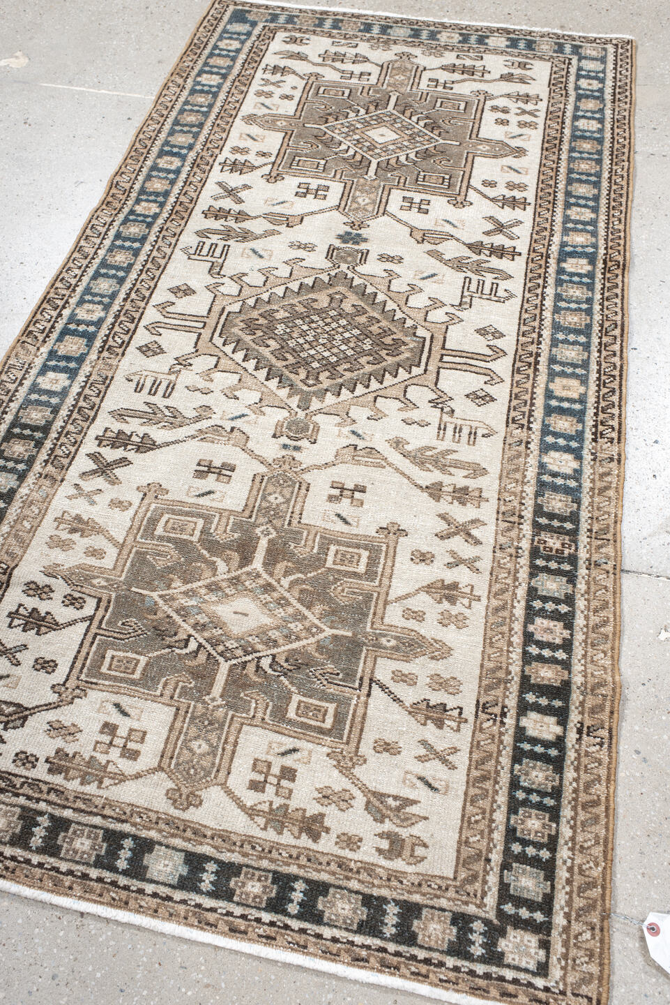 3' x 6' one-of-a-kind handmade vintage Karaje runner rug. Color palette: ivory, taupe, navy, brown, camel, charcoal, beige