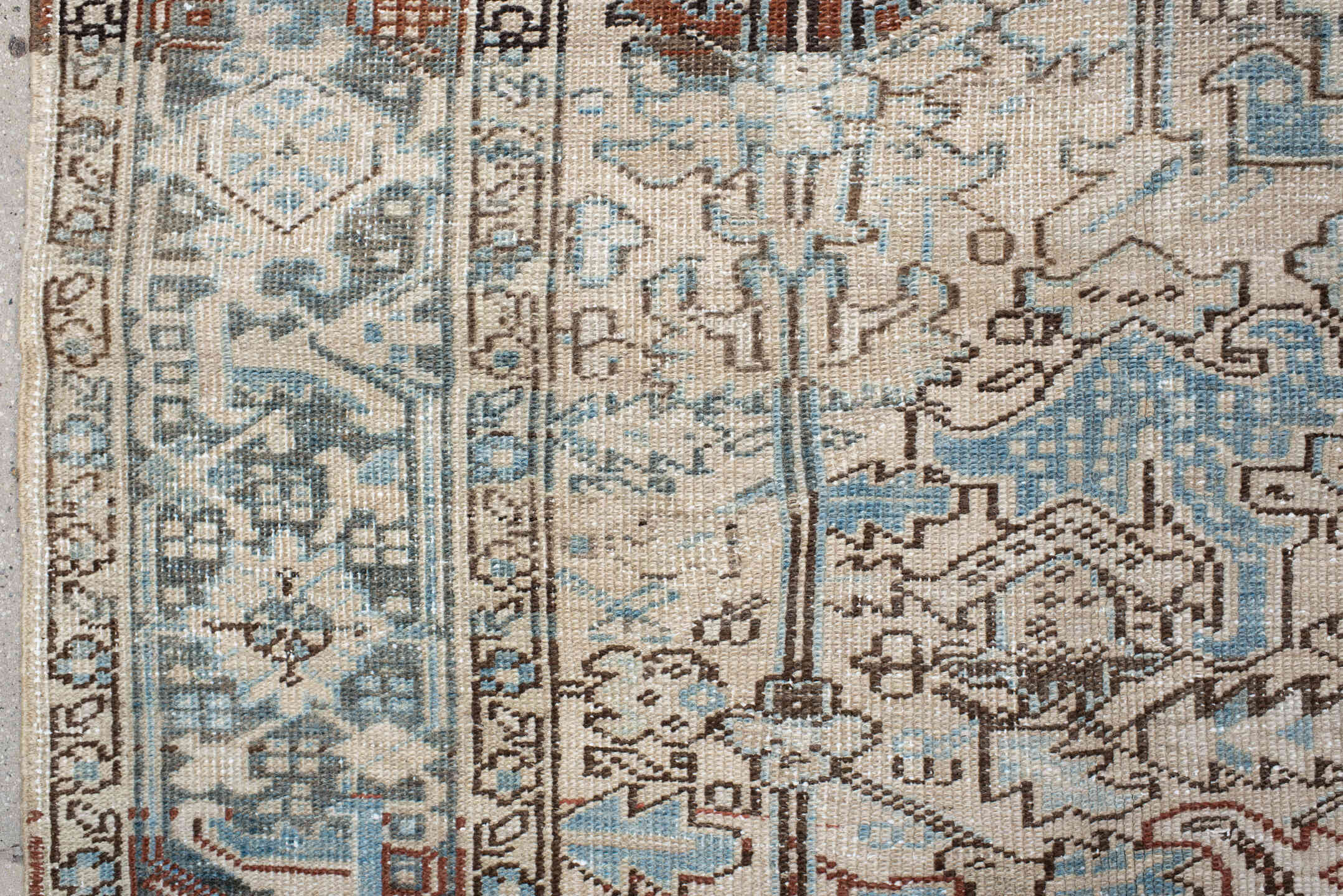 7' x 8' one-of-a-kind handmade antique Heriz rug. Color palette: ivory, sky blue, slate, taupe, rust, charcoal, camel
