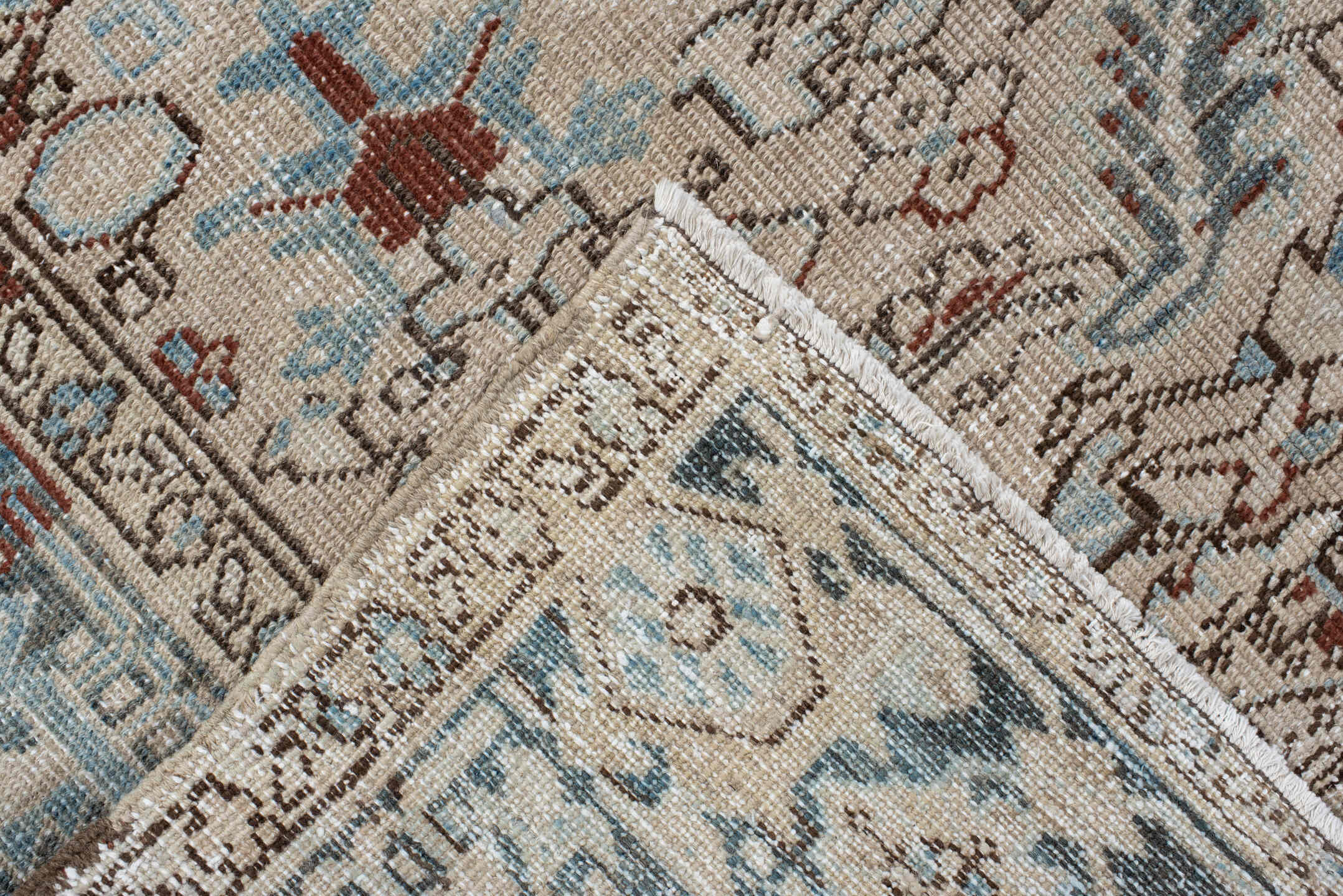 7' x 8' one-of-a-kind handmade antique Heriz rug. Color palette: ivory, sky blue, slate, taupe, rust, charcoal, camel