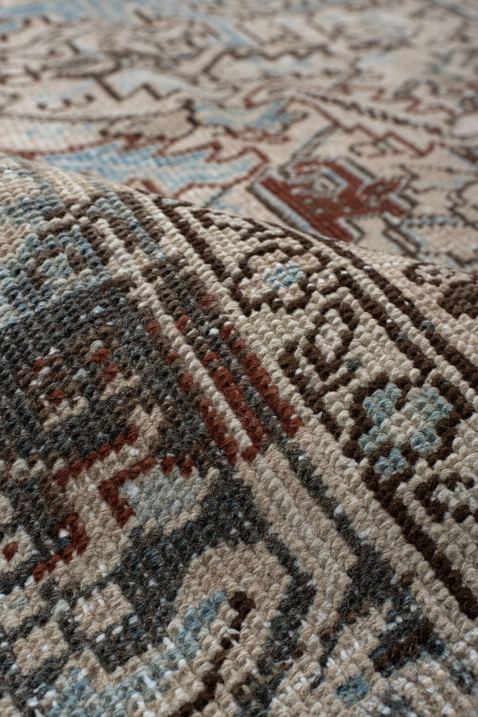 7' x 8' one-of-a-kind handmade antique Heriz rug. Color palette: ivory, sky blue, slate, taupe, rust, charcoal, camel