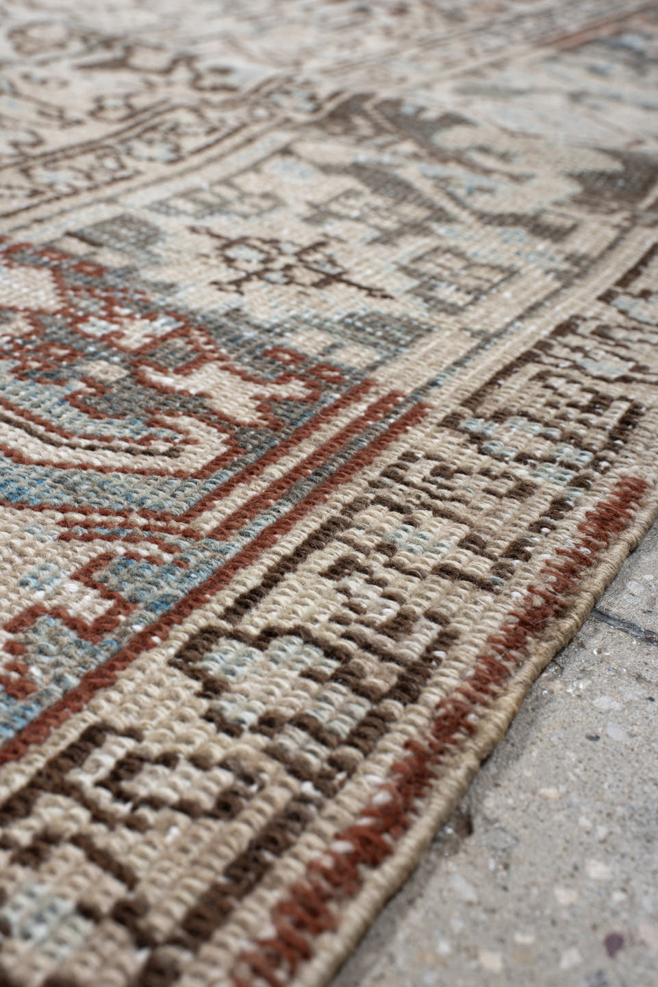 7' x 8' one-of-a-kind handmade antique Heriz rug. Color palette: ivory, sky blue, slate, taupe, rust, charcoal, camel