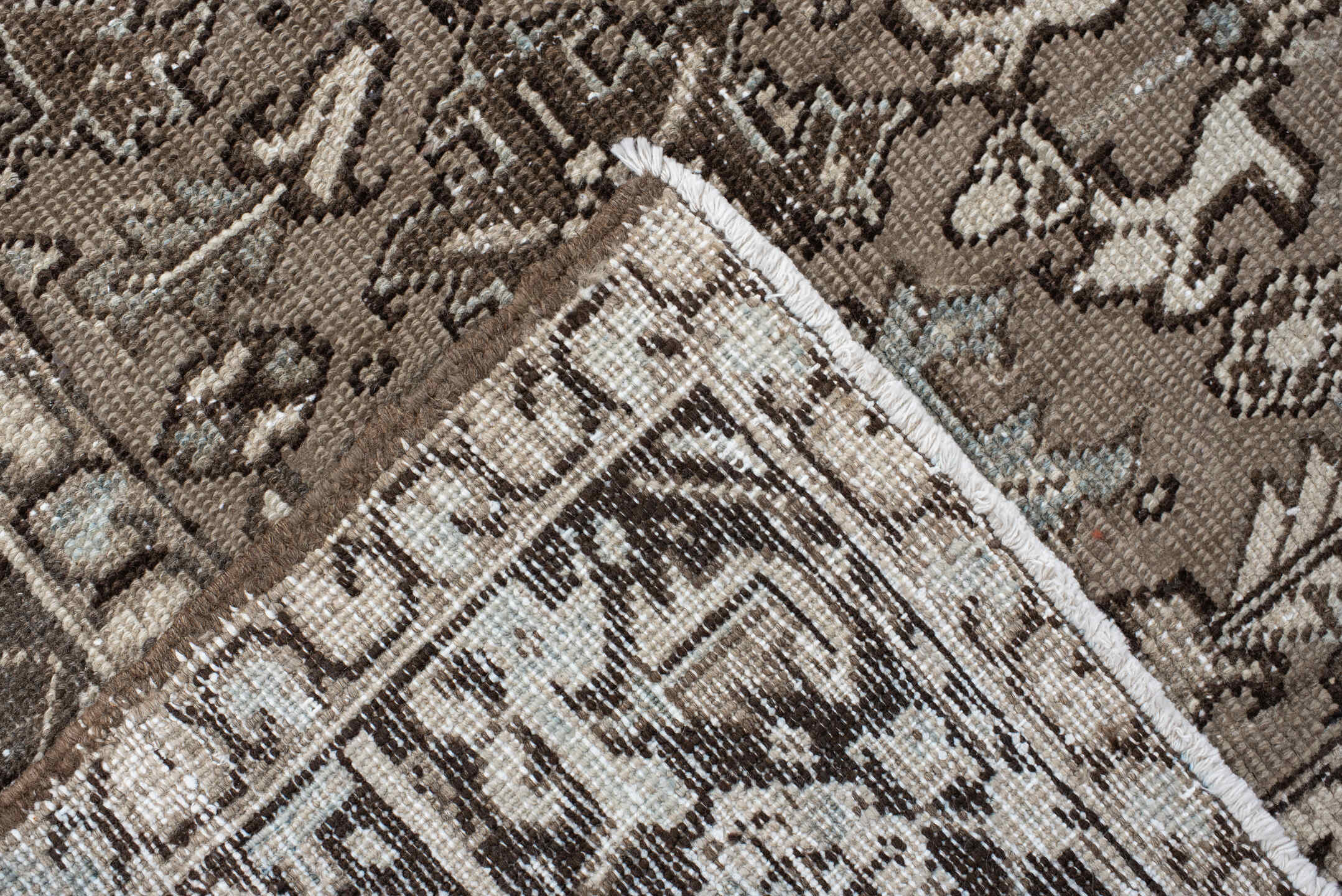 7' x 7' one-of-a-kind handmade antique Heriz rug. Color palette: taupe, ivory, charcoal, brown, slate, pale blue, beige