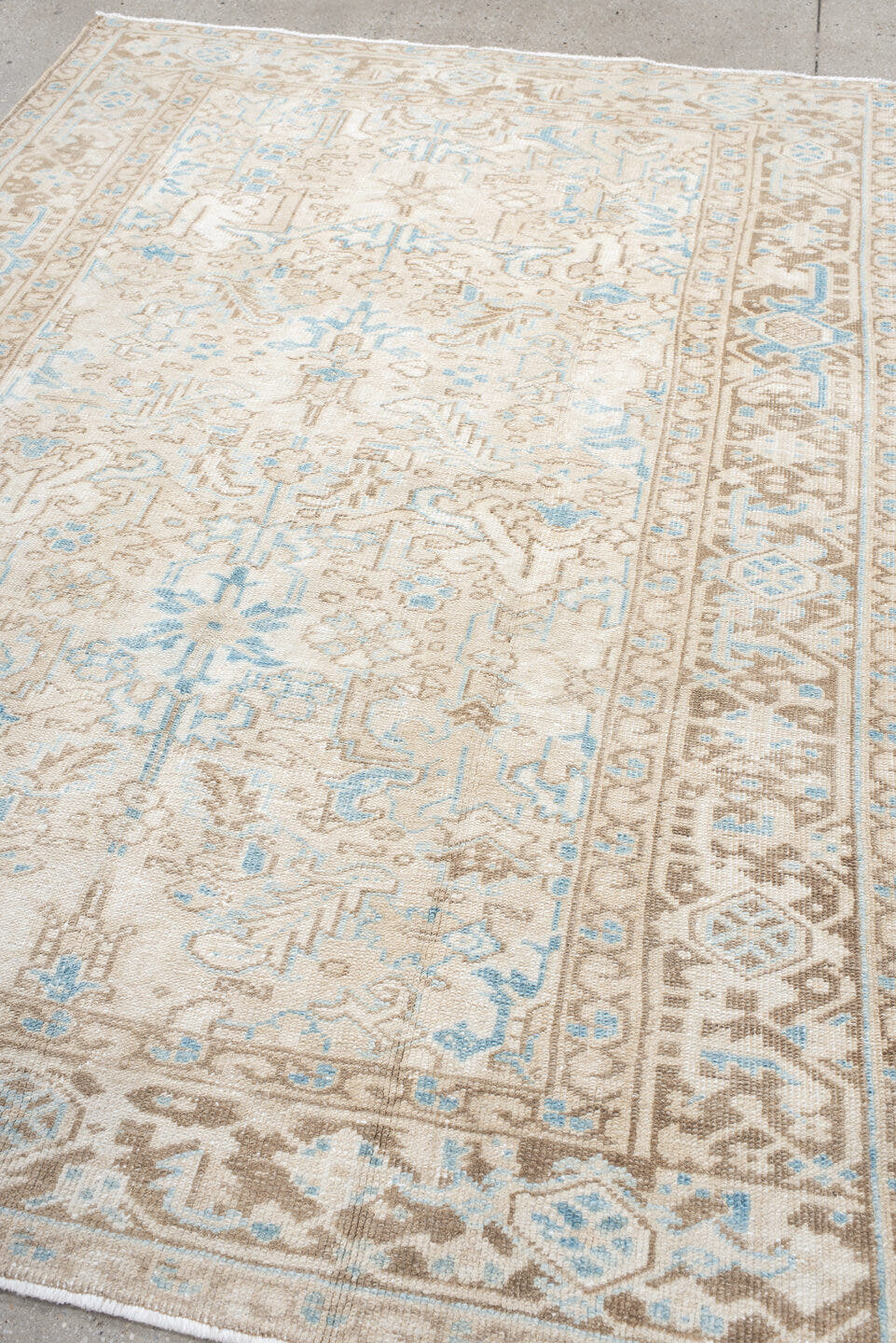 5' x 8' one-of-a-kind handmade vintage Heriz medium size rug. Color palette: ivory, taupe, sky blue, beige, gray, light blue