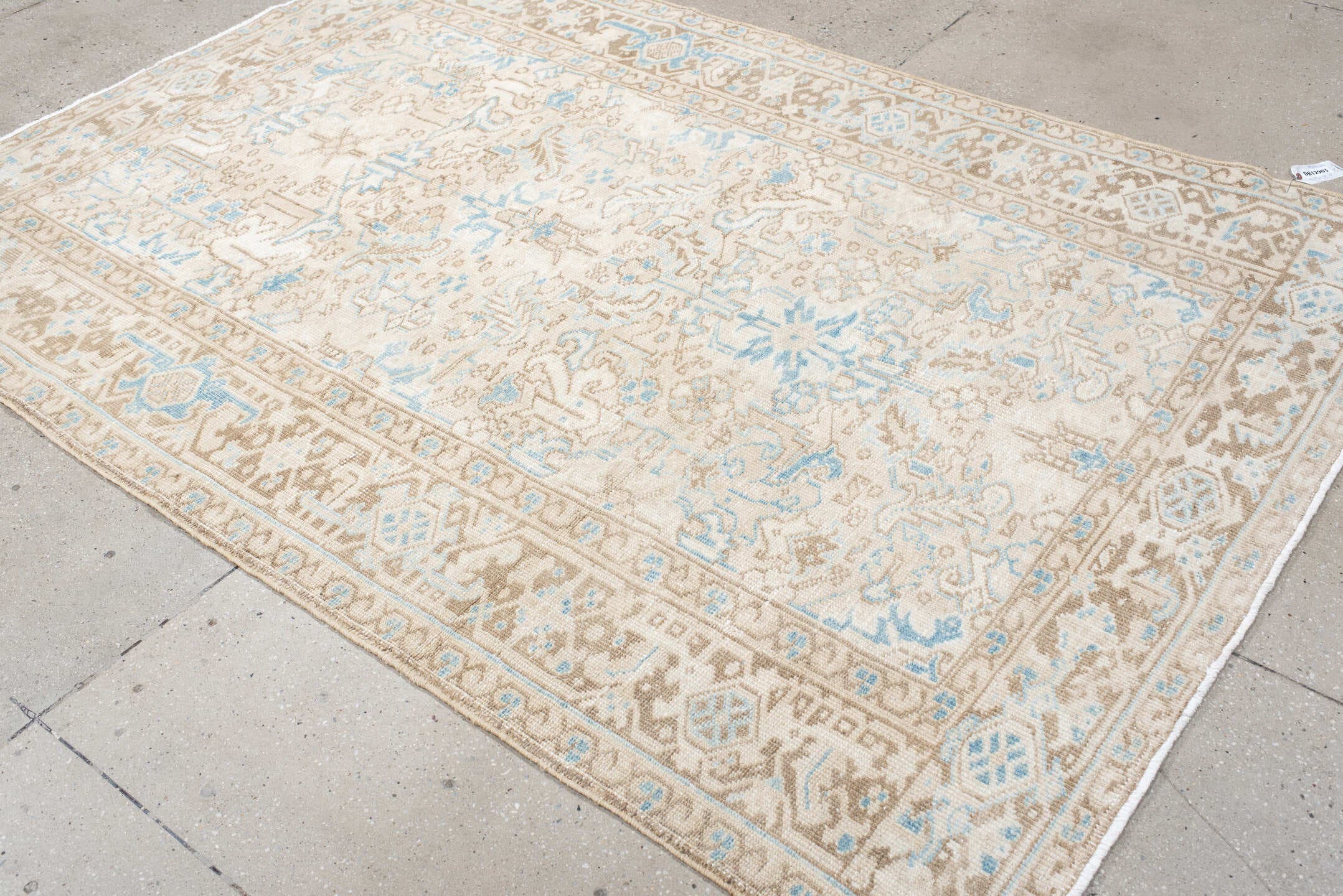 5' x 8' one-of-a-kind handmade vintage Heriz medium size rug. Color palette: ivory, taupe, sky blue, beige, gray, light blue