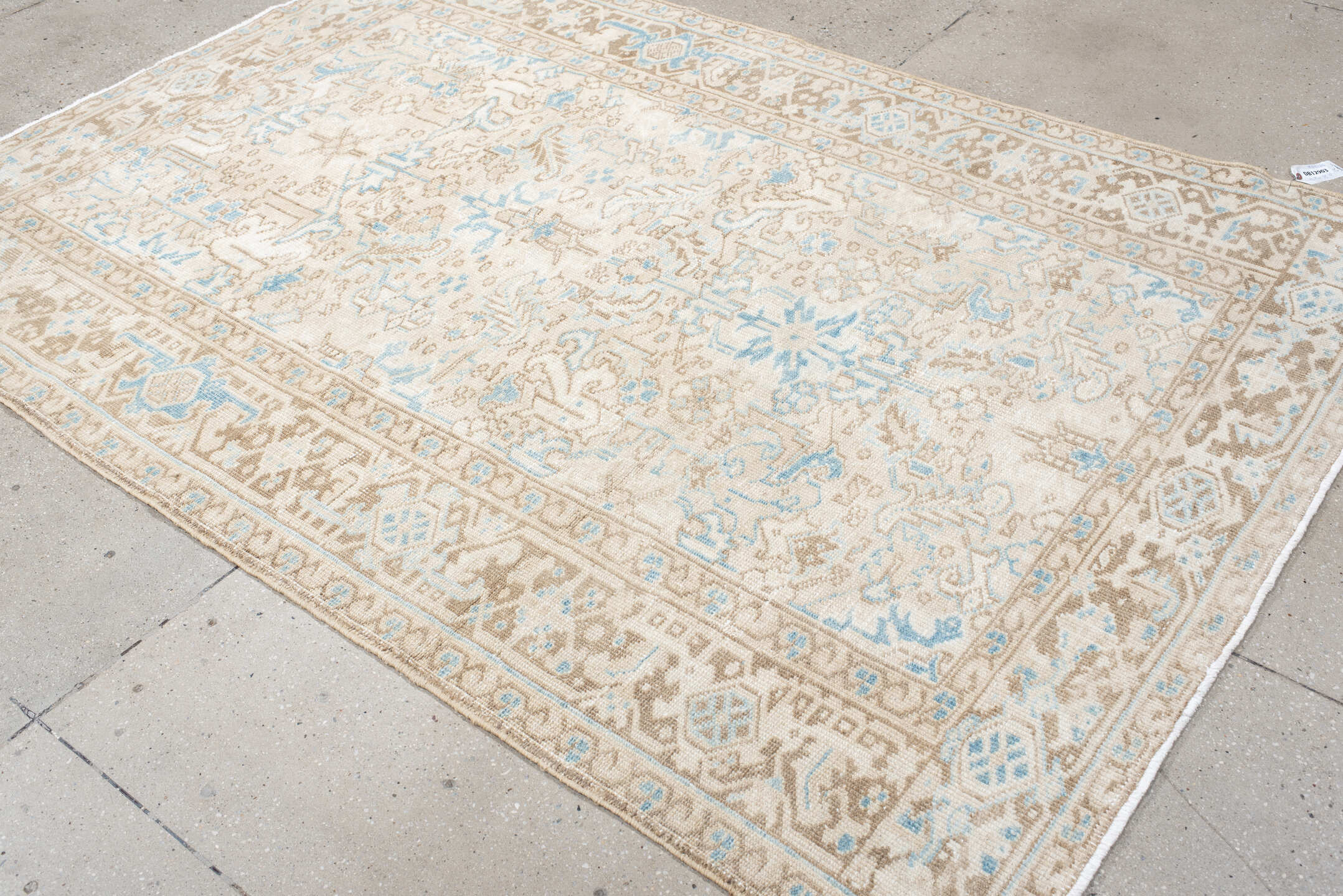 5' x 8' one-of-a-kind handmade vintage Heriz medium size rug. Color palette: ivory, taupe, sky blue, beige, gray, light blue