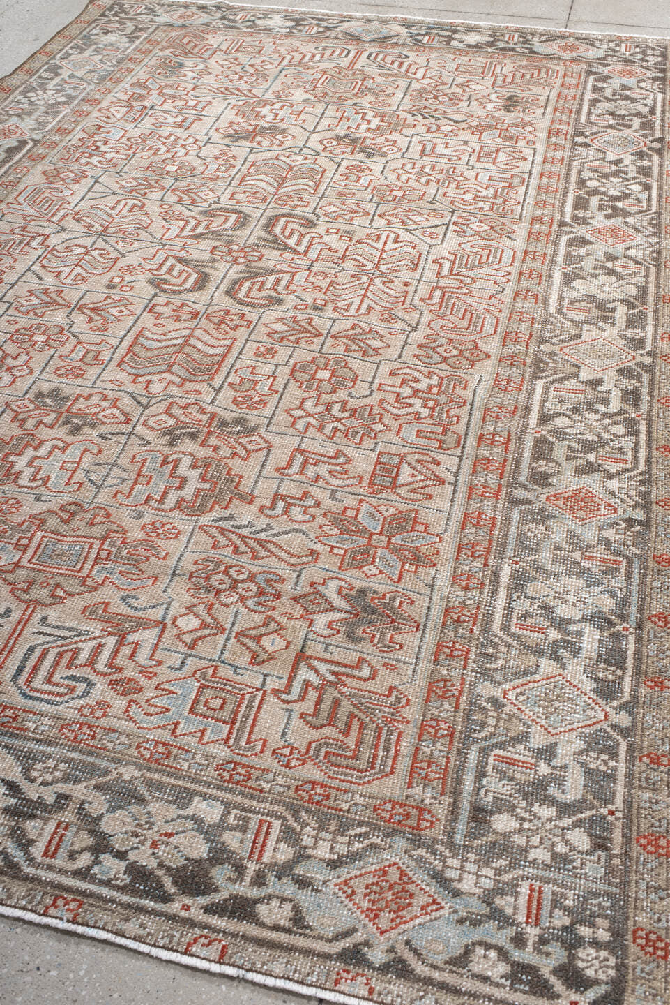 6' x 9' one-of-a-kind handmade antique Heriz medium size rug. Color palette: ivory, charcoal, rust, sky_blue, taupe, gray