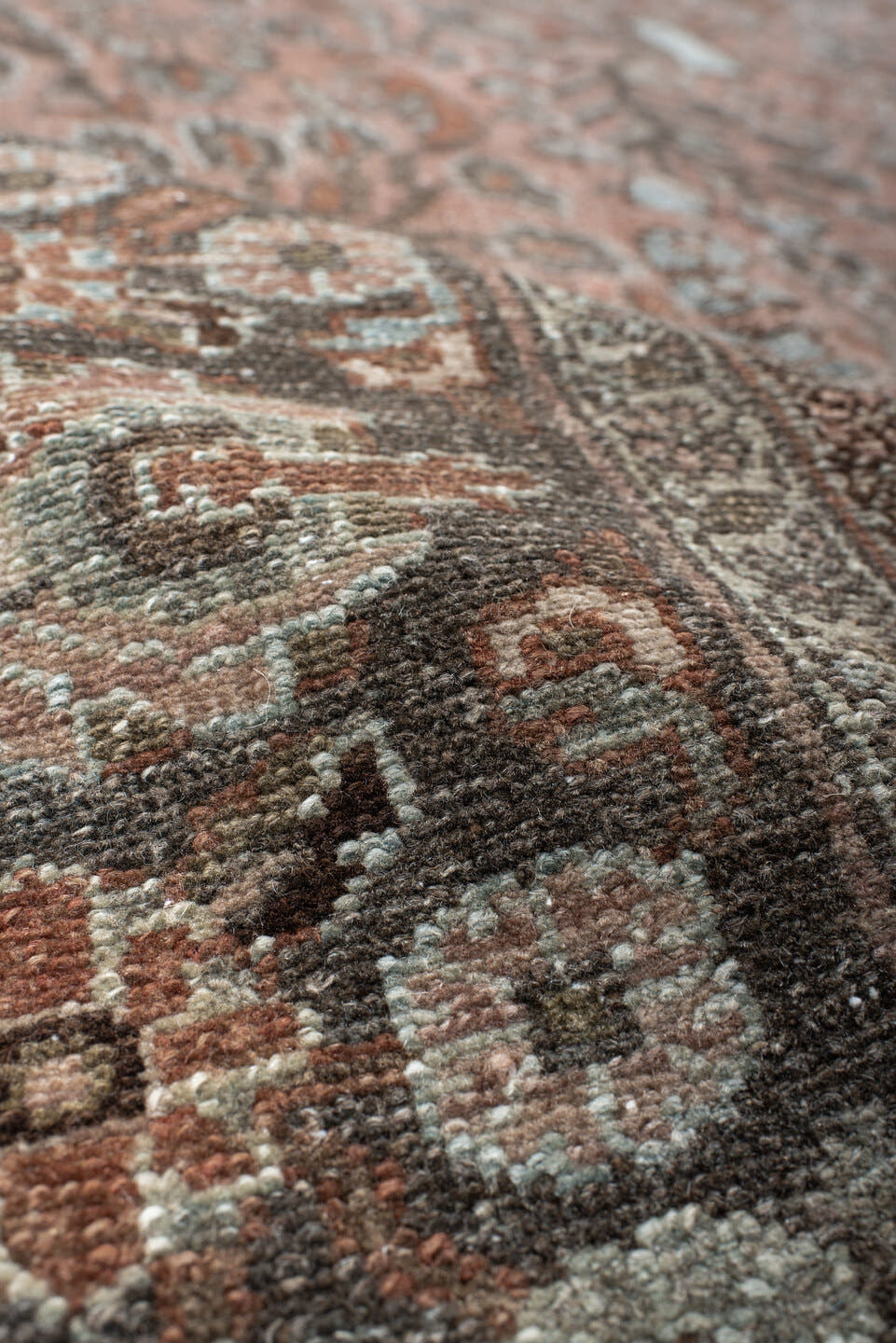 7' x 9' one-of-a-kind handmade antique Lilian rug. Color palette: rose, charcoal, dusty pink, ivory, taupe, rust, slate