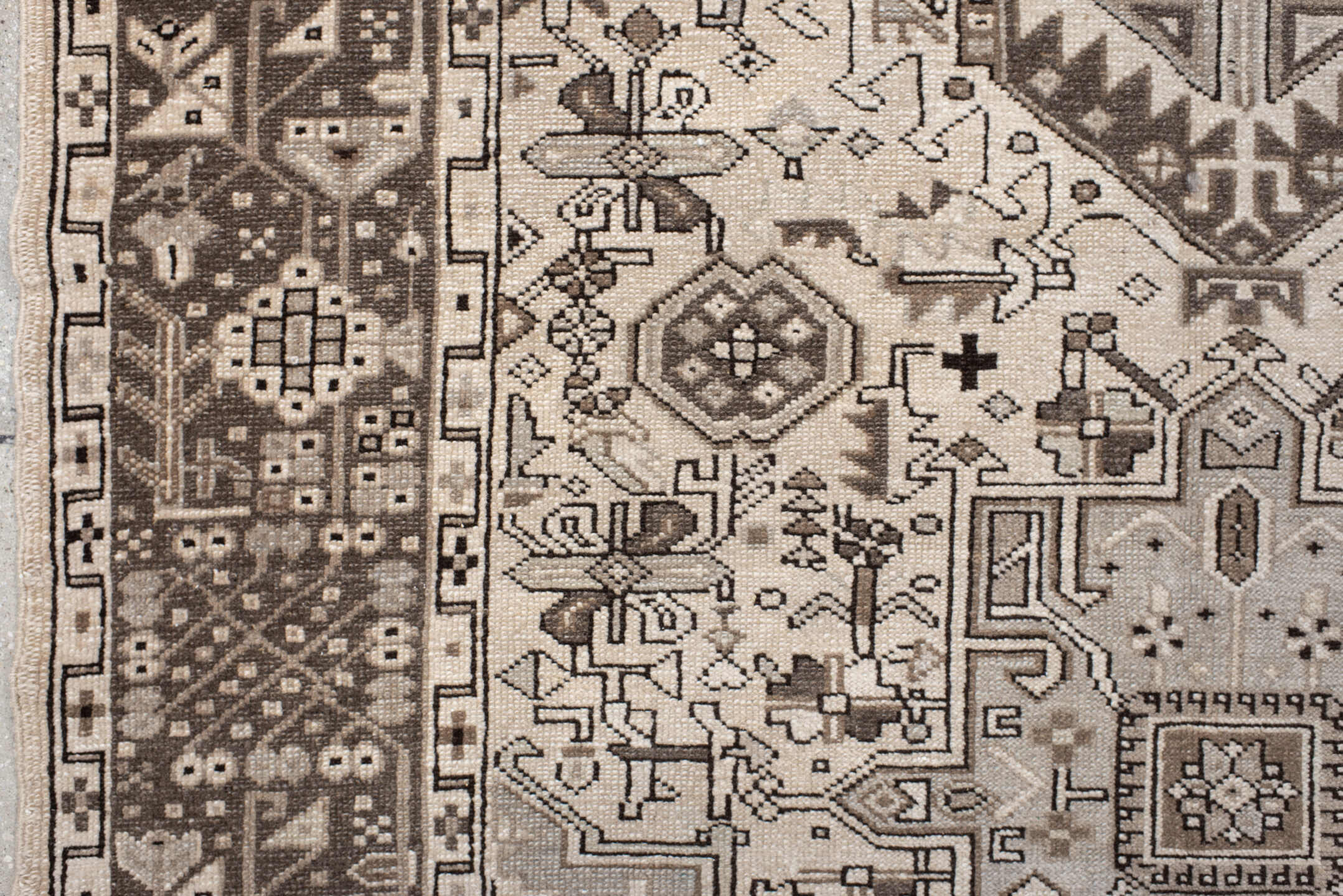 5' x 6' one-of-a-kind handmade vintage Karaje rug. Color palette: black, brown, gray, light gray, off-white, pink