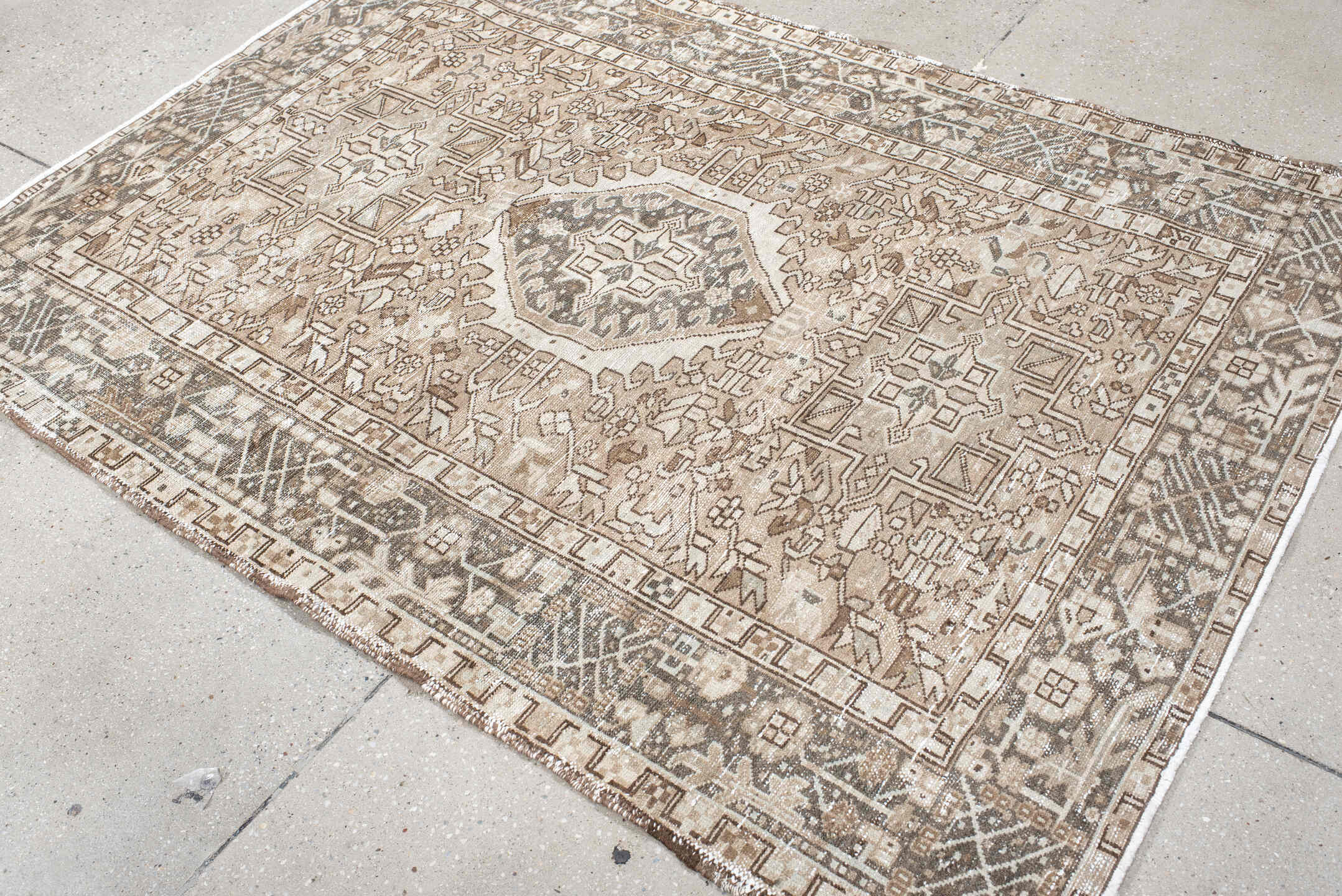 4' x 6' one-of-a-kind handmade vintage Karaje small size rug. Color palette: ivory, taupe, brown, camel, charcoal, beige