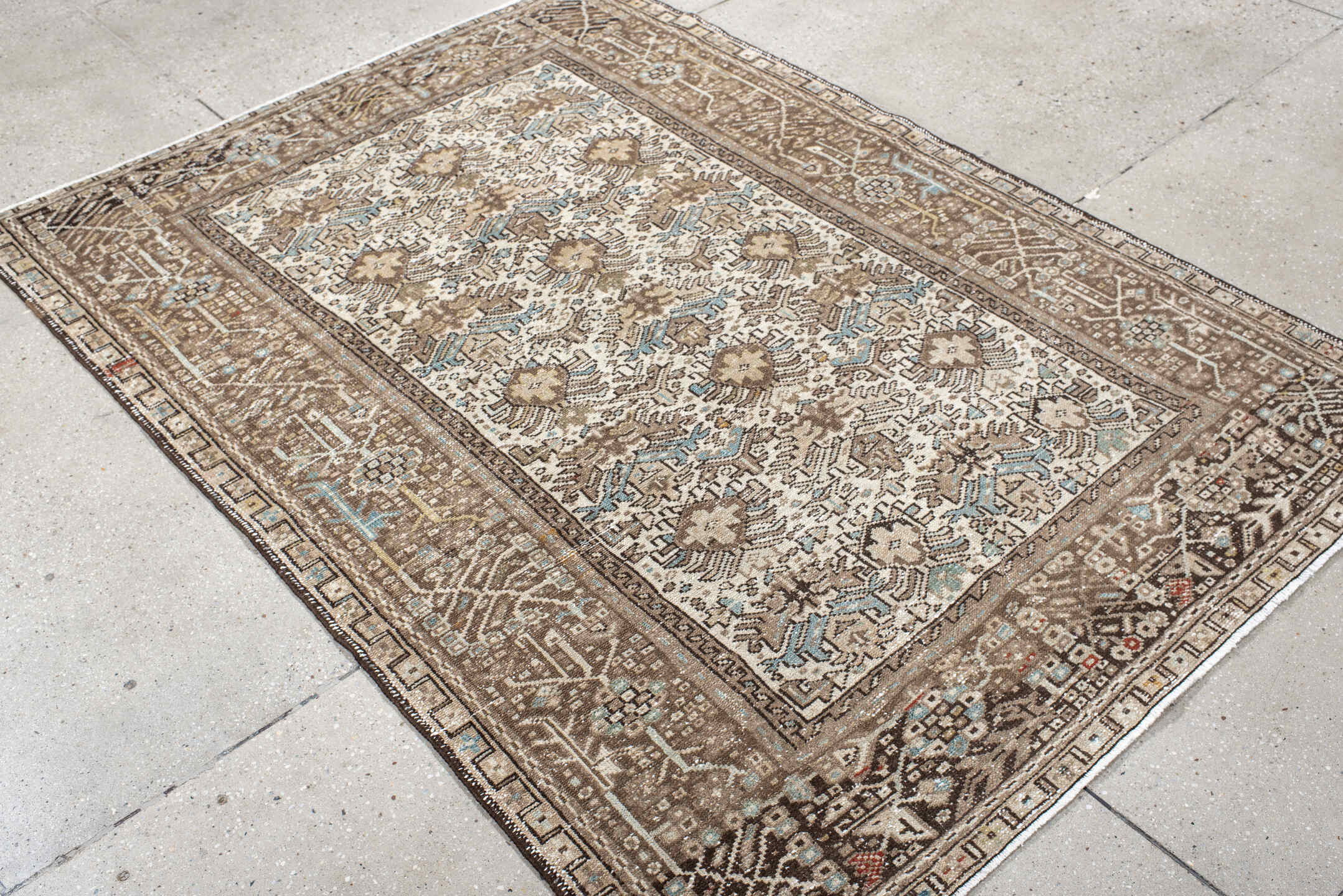 4' x 6' one-of-a-kind handmade antique Karaje small size rug. Color palette: ivory, taupe, brown, sky blue, charcoal, camel