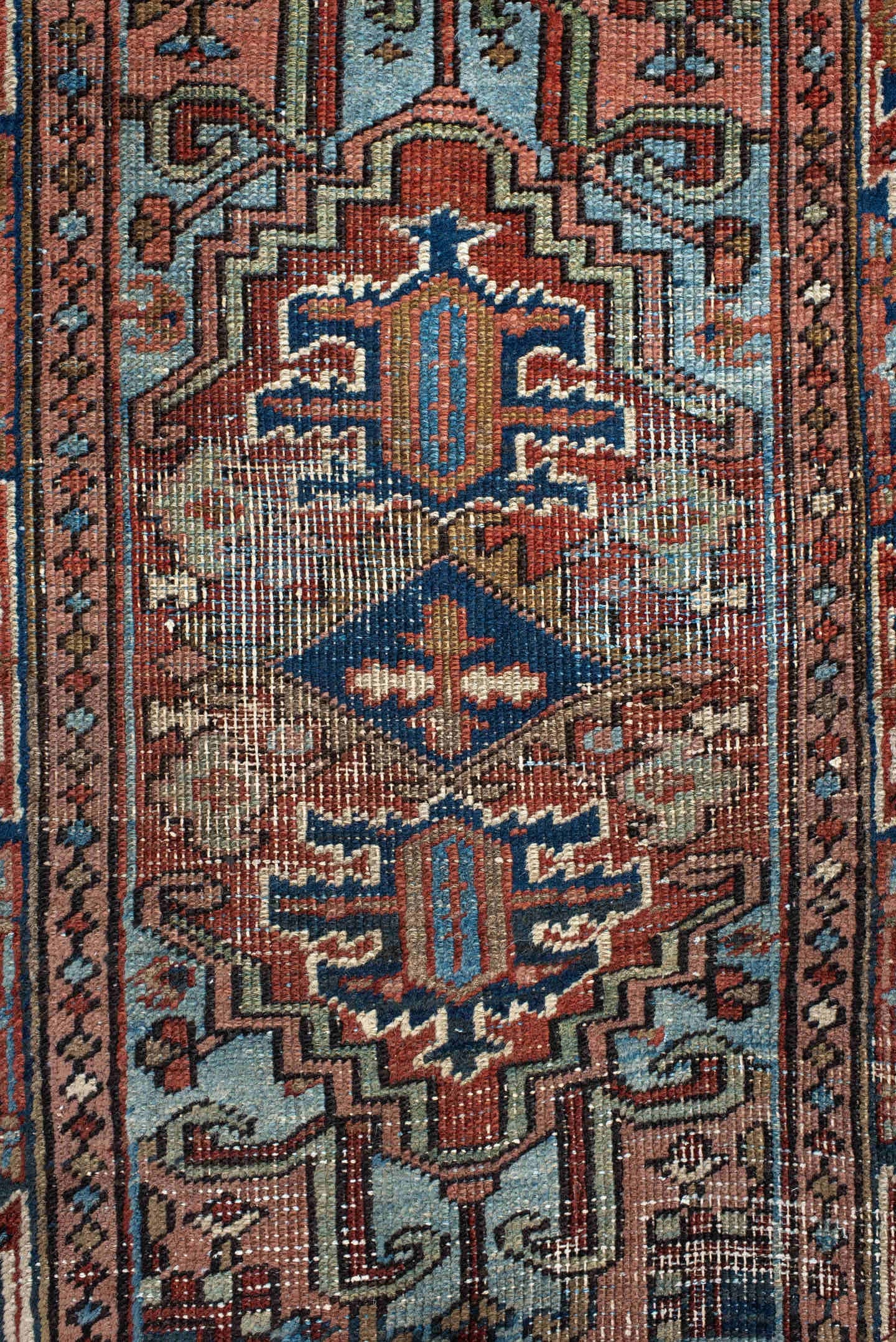 2' x 3' one-of-a-kind handmade antique Heriz small size rug. Color palette: navy, ivory, rust, sky_blue, camel, rose