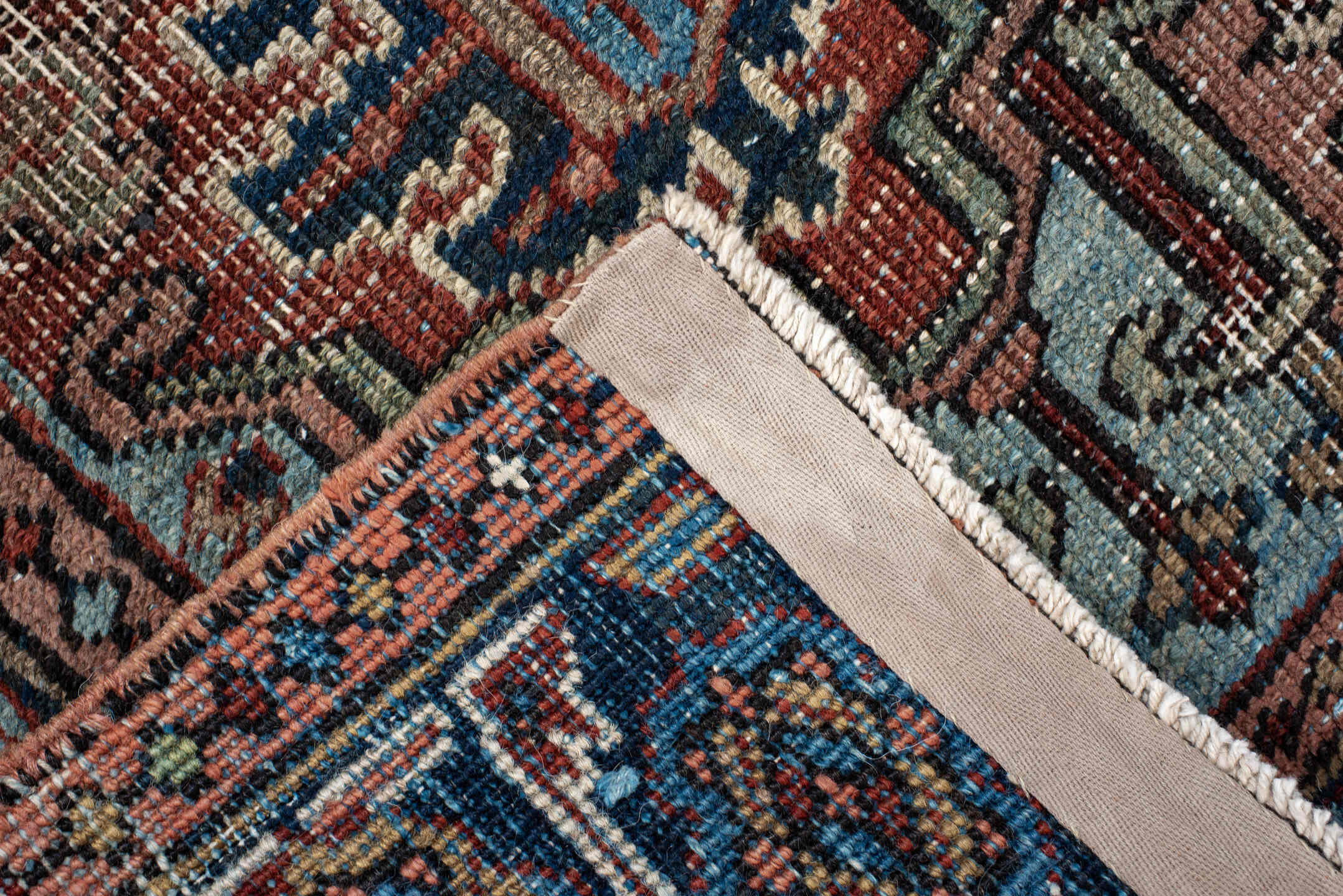 2' x 3' one-of-a-kind handmade antique Heriz small size rug. Color palette: navy, ivory, rust, sky_blue, camel, rose