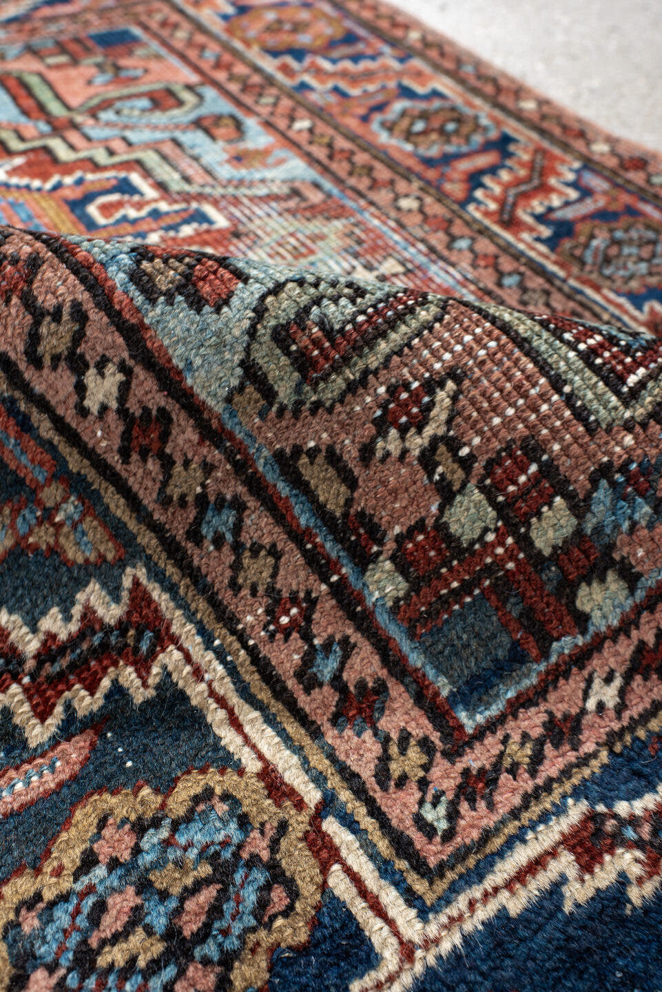 2' x 3' one-of-a-kind handmade antique Heriz small size rug. Color palette: navy, ivory, rust, sky_blue, camel, rose