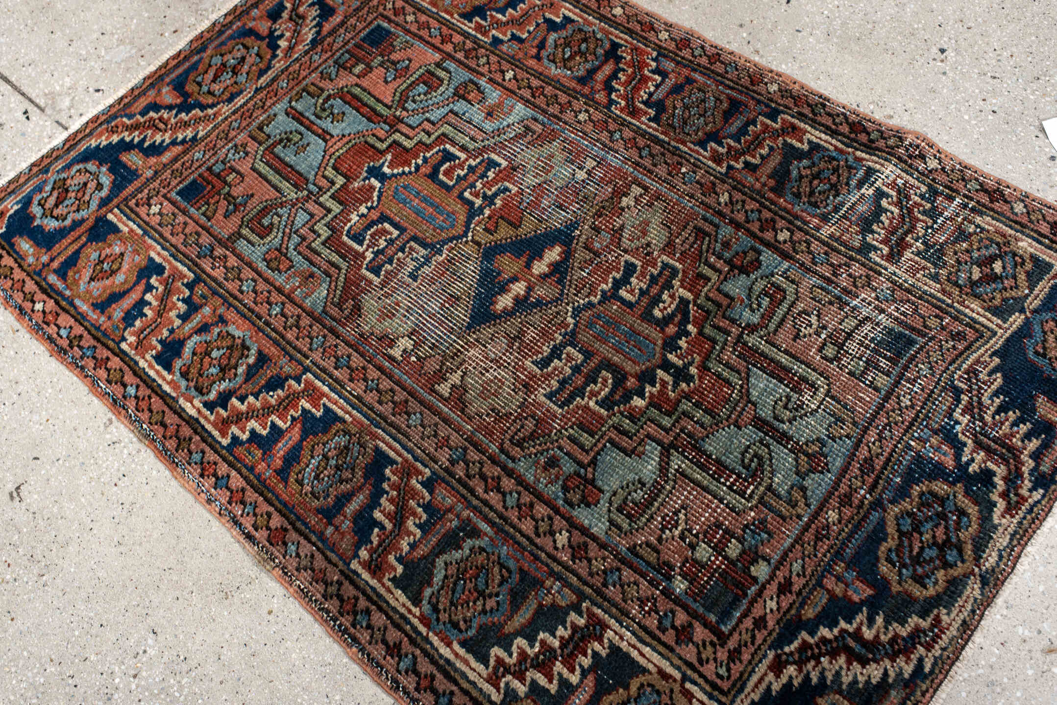 2' x 3' one-of-a-kind handmade antique Heriz small size rug. Color palette: navy, ivory, rust, sky_blue, camel, rose