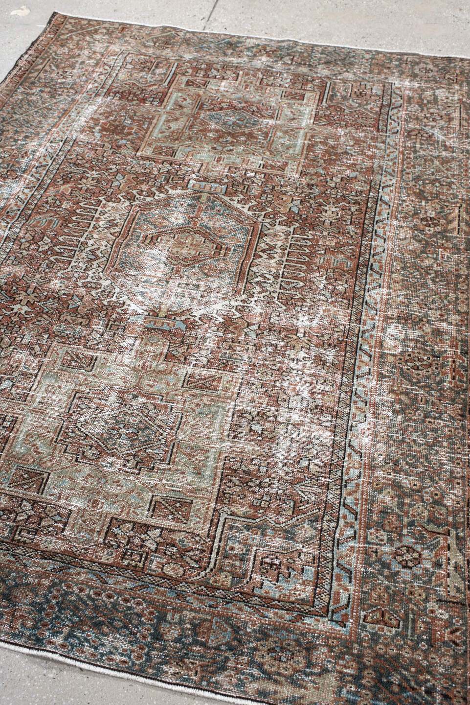 4' x 5' one-of-a-kind handmade antique Karaje small size rug. Color palette: rust, ivory, sage, charcoal, terra cotta, taupe
