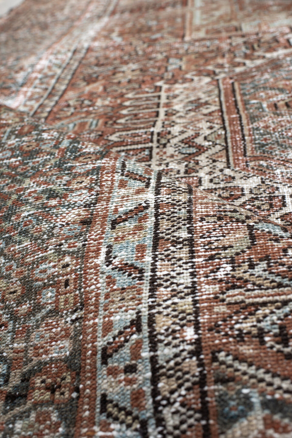 4' x 5' one-of-a-kind handmade antique Karaje small size rug. Color palette: rust, ivory, sage, charcoal, terra cotta, taupe