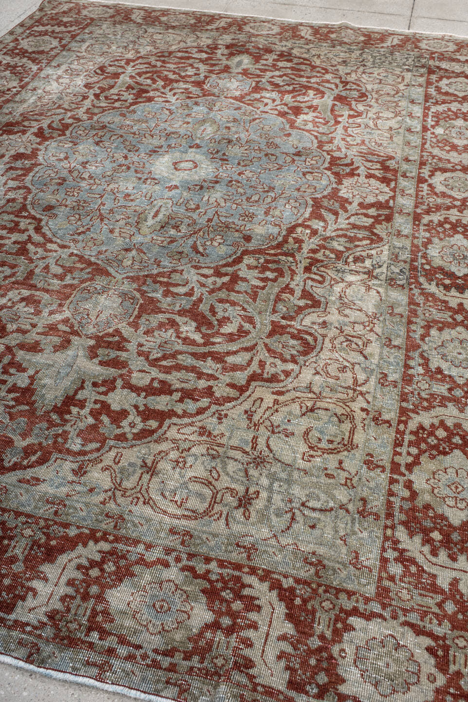 7' x 10' one-of-a-kind handmade antique Heriz large size rug. Color palette: rust, pale blue, ivory, brick, sage, taupe