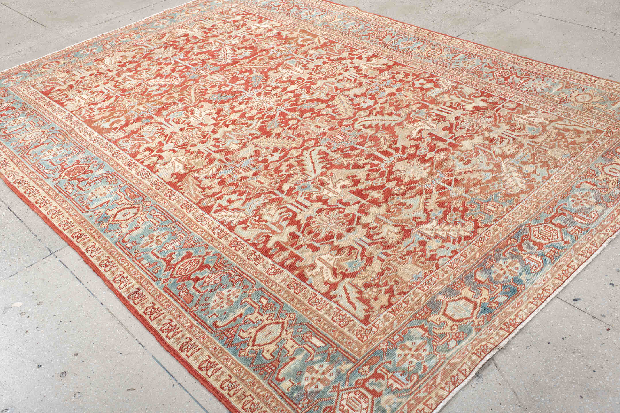 7' x 10' one-of-a-kind handmade antique Heriz large size rug. Color palette: rust, ivory, sky blue, coral, brick, cream