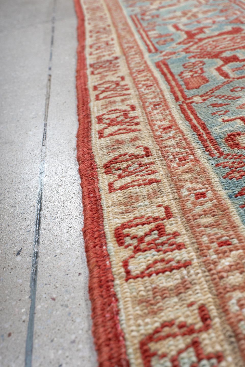7' x 10' one-of-a-kind handmade antique Heriz large size rug. Color palette: rust, ivory, sky blue, coral, brick, cream