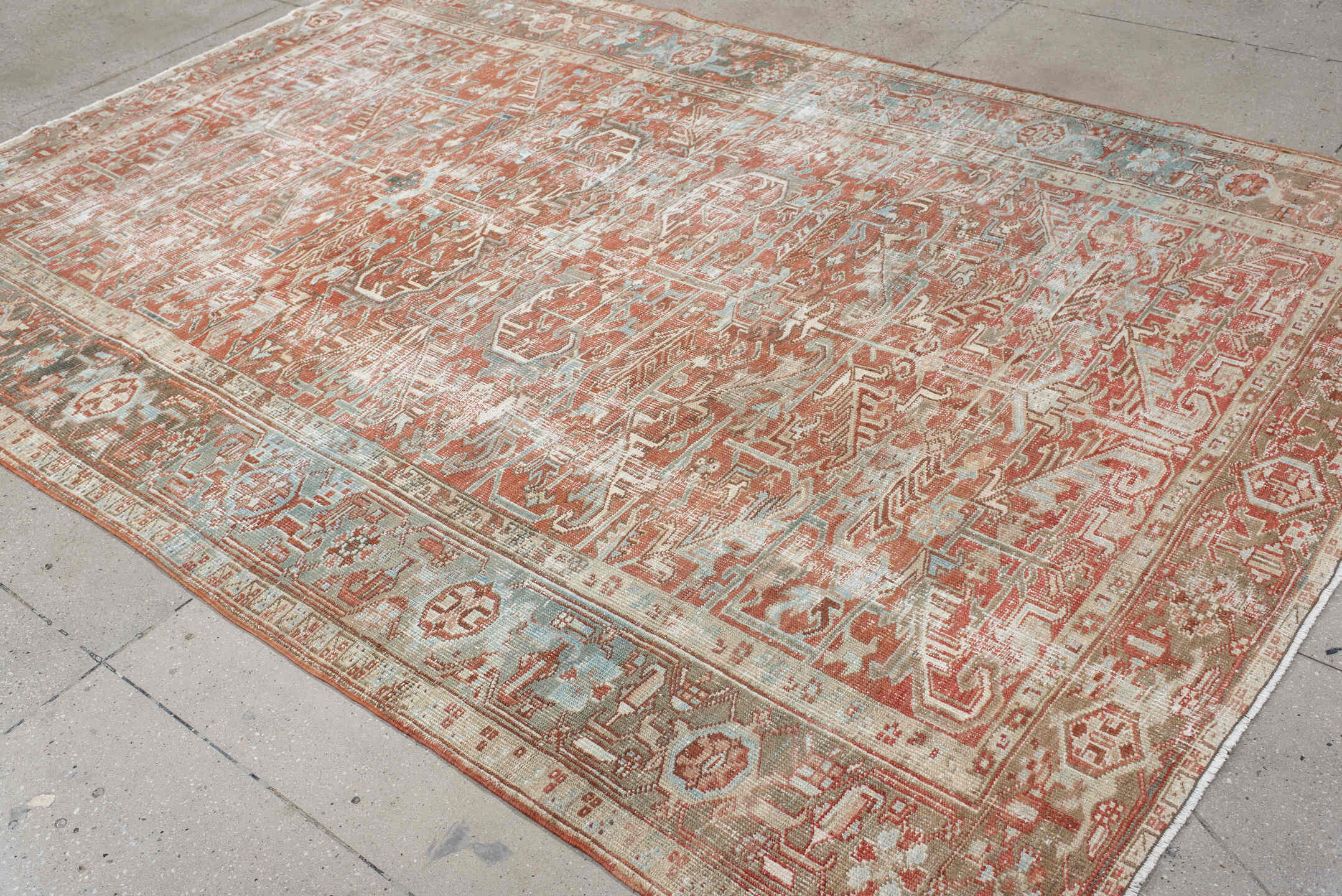 7' x 10' one-of-a-kind handmade vintage Heriz large size rug. Color palette: ivory, terra cotta, pale blue, sage, taupe