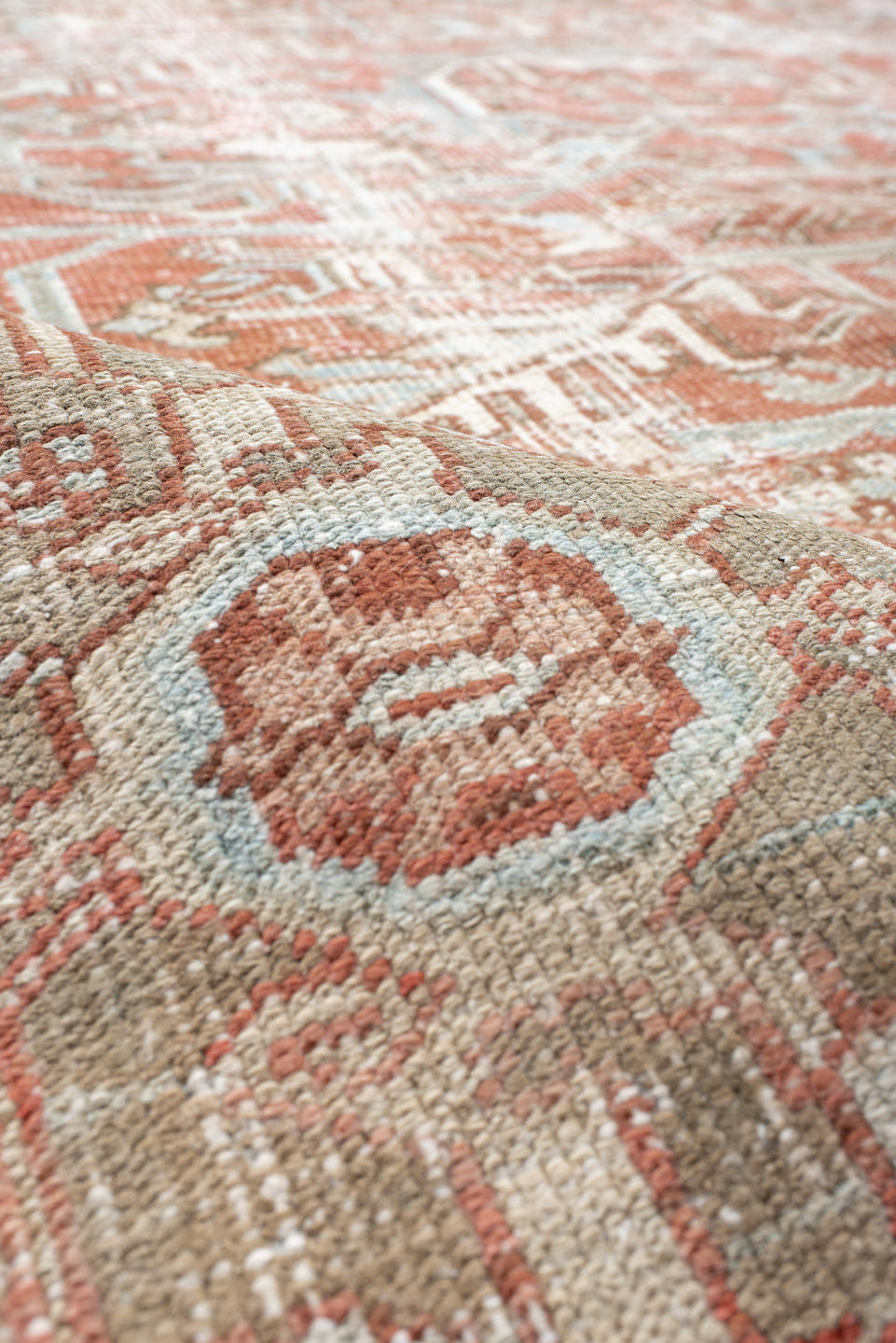 7' x 10' one-of-a-kind handmade vintage Heriz large size rug. Color palette: ivory, terra cotta, pale blue, sage, taupe