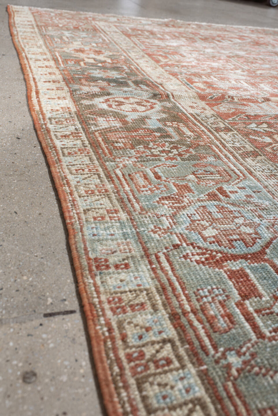 7' x 10' one-of-a-kind handmade vintage Heriz large size rug. Color palette: ivory, terra cotta, pale blue, sage, taupe