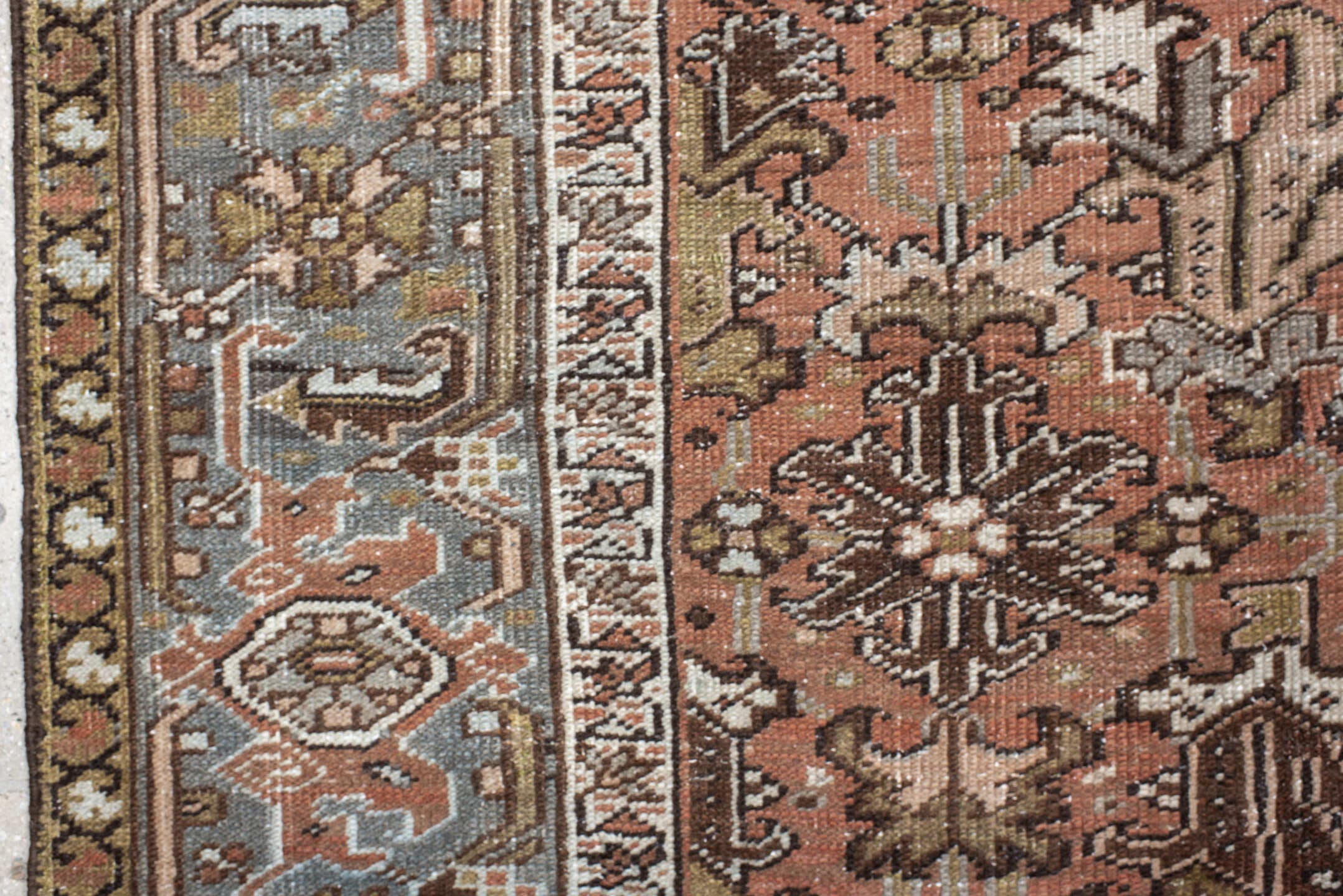 7' x 8' one-of-a-kind handmade antique Heriz rug. Color palette: terra cotta, slate, ivory, taupe, charcoal, olive, rust