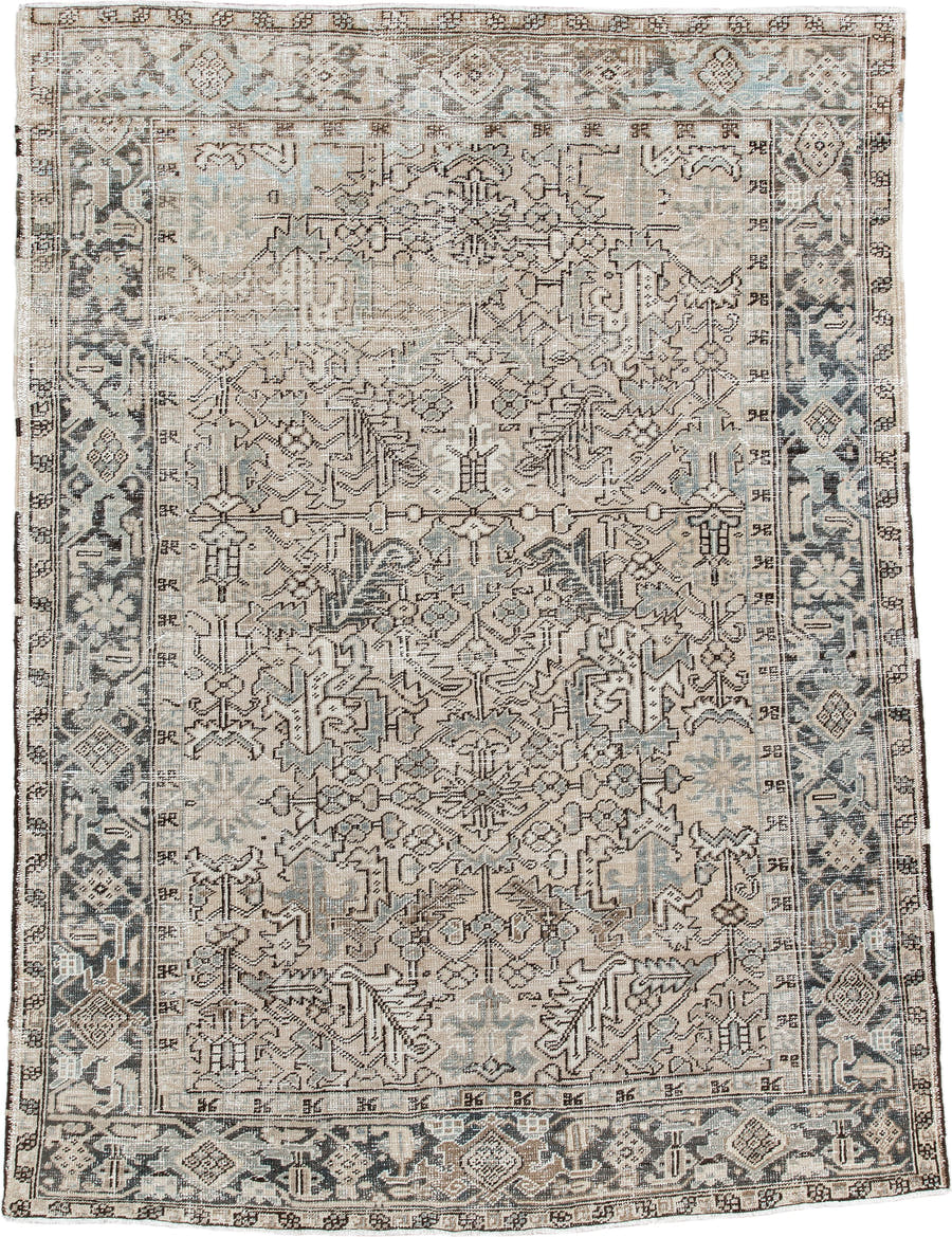 7' x 9' one-of-a-kind handmade antique Heriz rug. Color palette: ivory, taupe, slate, charcoal, camel, pale blue, brown