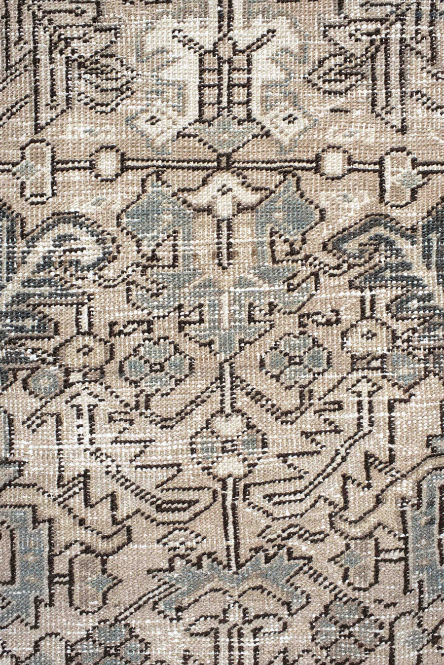 7' x 9' one-of-a-kind handmade antique Heriz rug. Color palette: ivory, taupe, slate, charcoal, camel, pale blue, brown