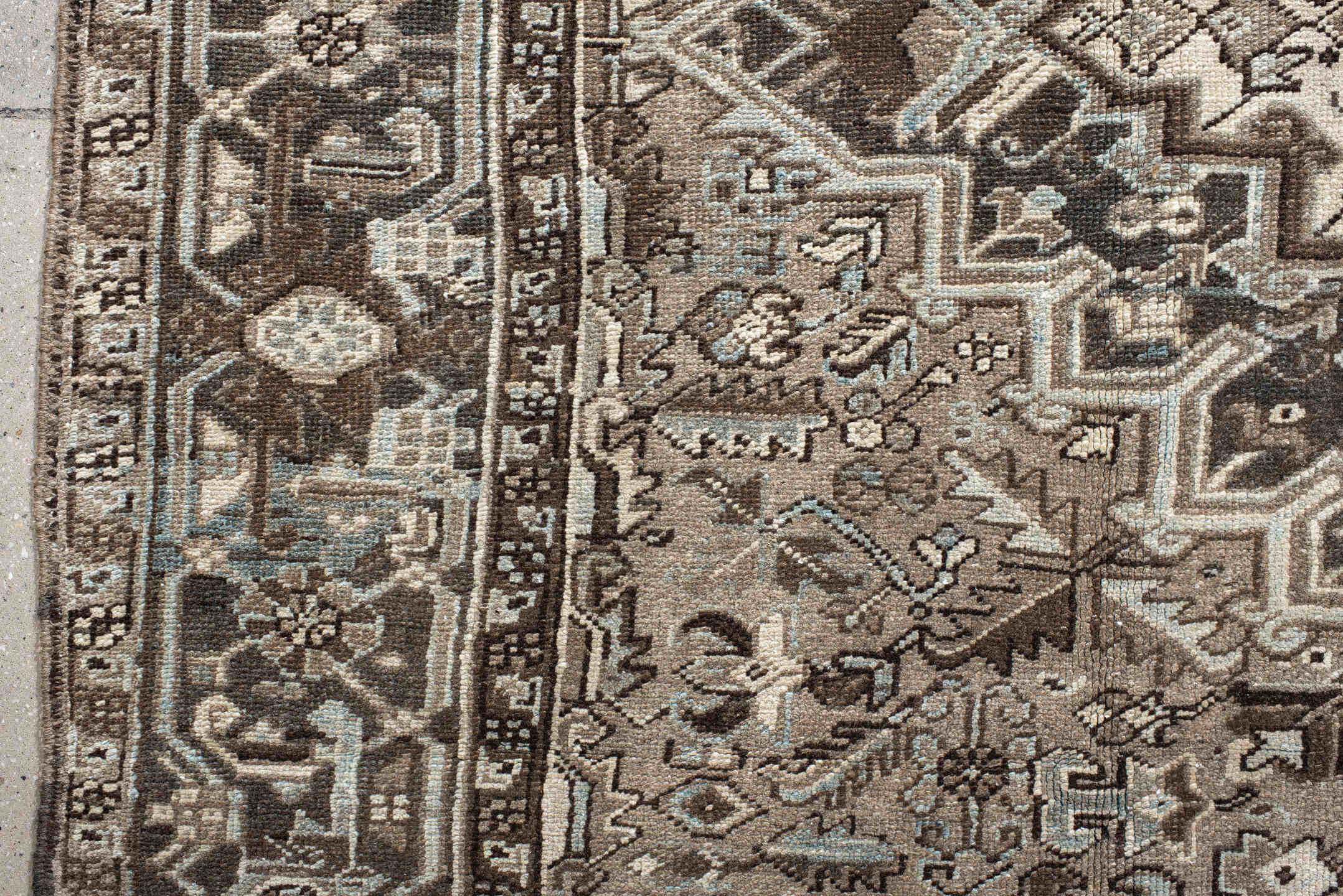 7' x 11' one-of-a-kind handmade antique Heriz large size rug. Color palette: taupe, brown, ivory, charcoal, pale blue, camel