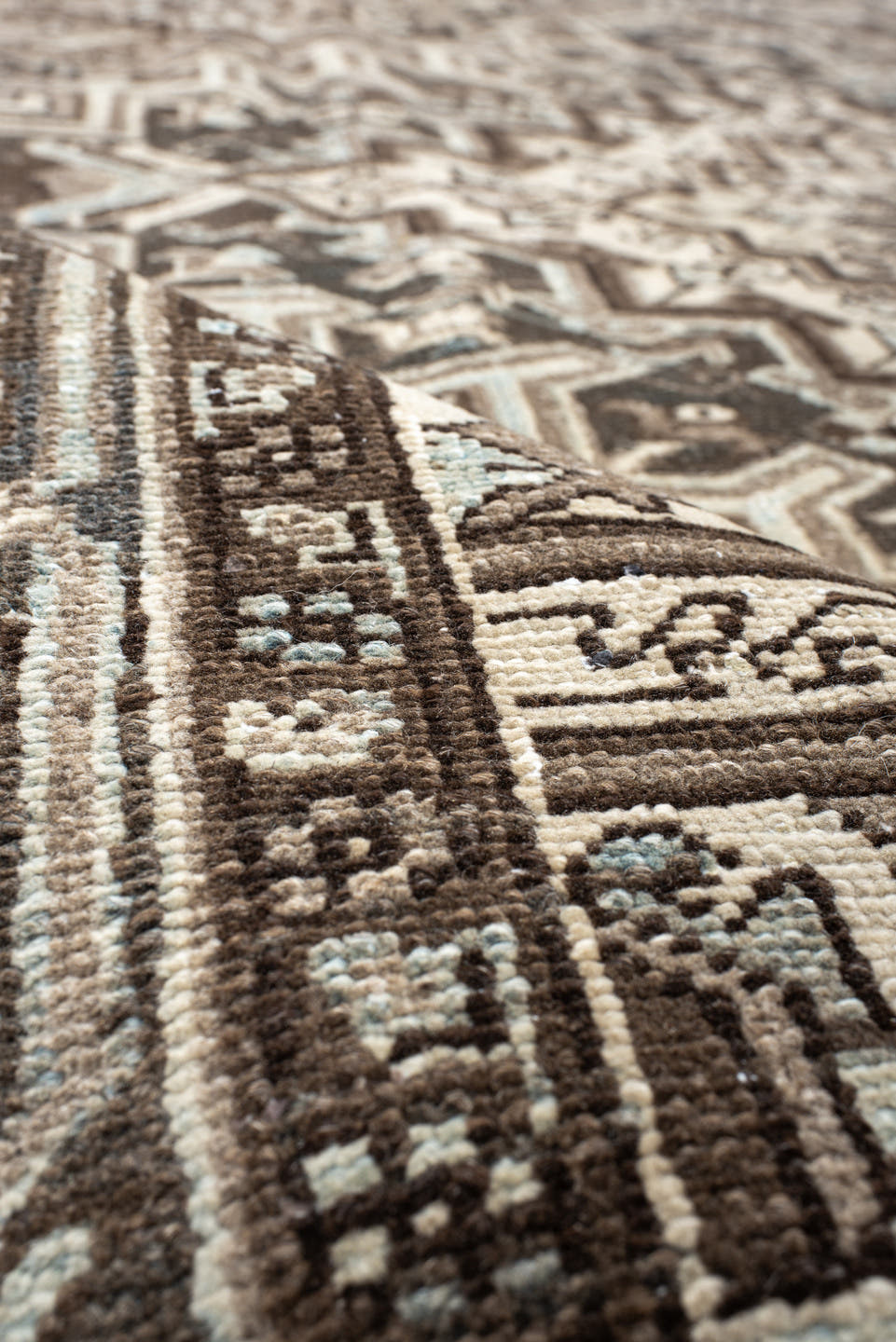 7' x 11' one-of-a-kind handmade antique Heriz large size rug. Color palette: taupe, brown, ivory, charcoal, pale blue, camel